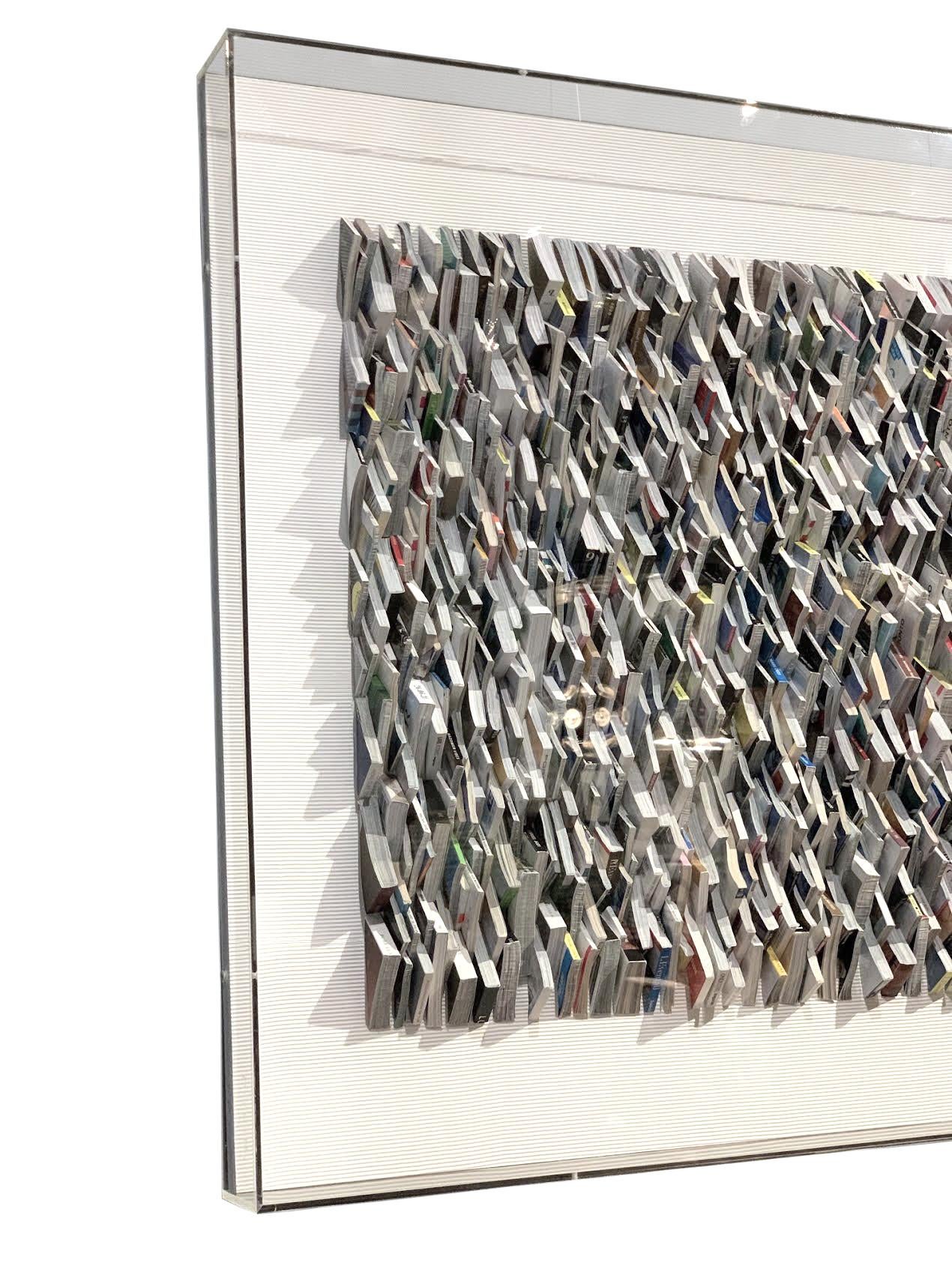 Contemporary artist Guy Leclef from his collection of Paper Works.
Cut pieces of hand folded colored pages from various international magazines folded and placed to create a unique and dramatic wall sculpture
All triangular shaped.
Folded paper