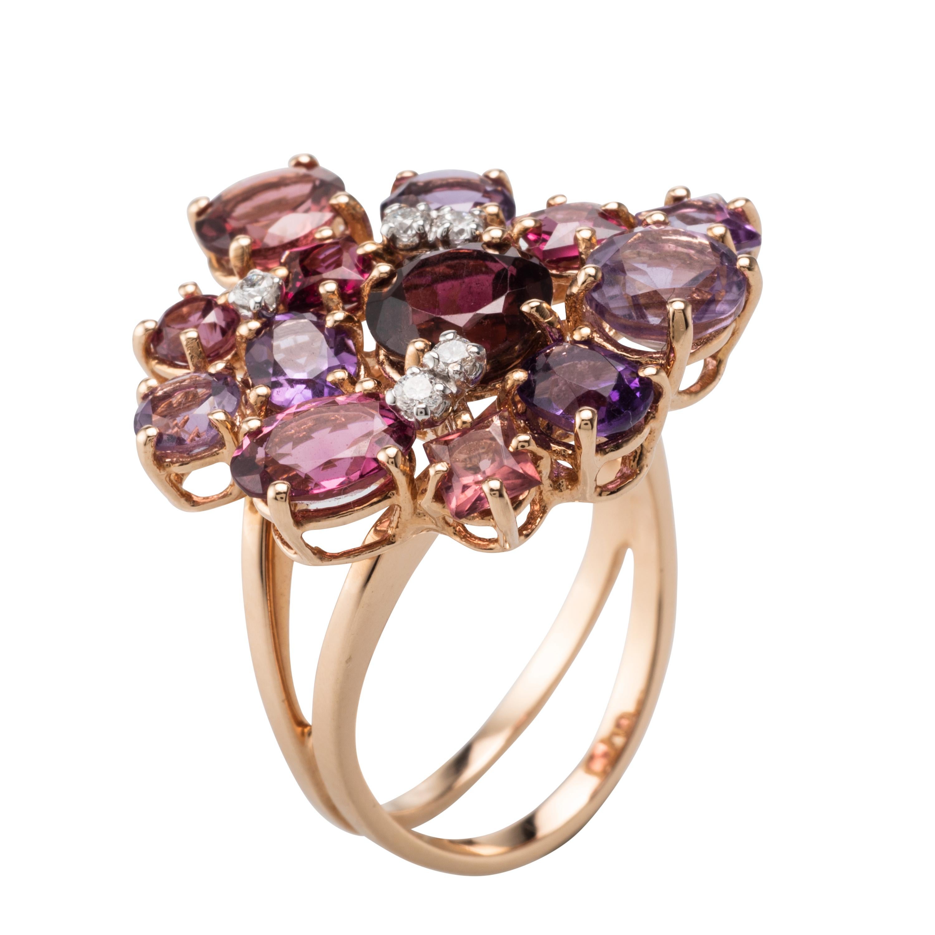 This 18 Karat Rose Gold Ring features Amethysts, Garnets and Diamonds. This Cocktail Ring is truly an impressive piece of jewellery. Produced in Italy, with attention to a very small detail.
7.5 carat of gemstones, 0.15 carat diamonds. 
Ring can be