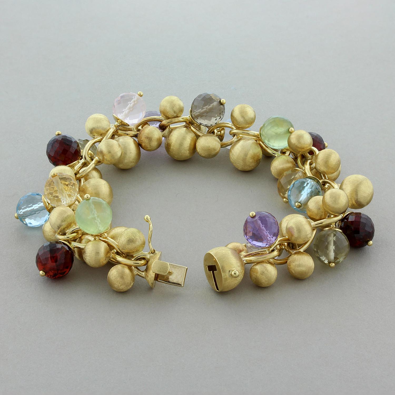 This fun and full of life bracelet featuring beads of multi-color gemstones which include amethyst, garnet, citrine and topaz. They are beaded and faceted to add fire and brilliance to the stones. They are accented by lightweight gold spheres with a