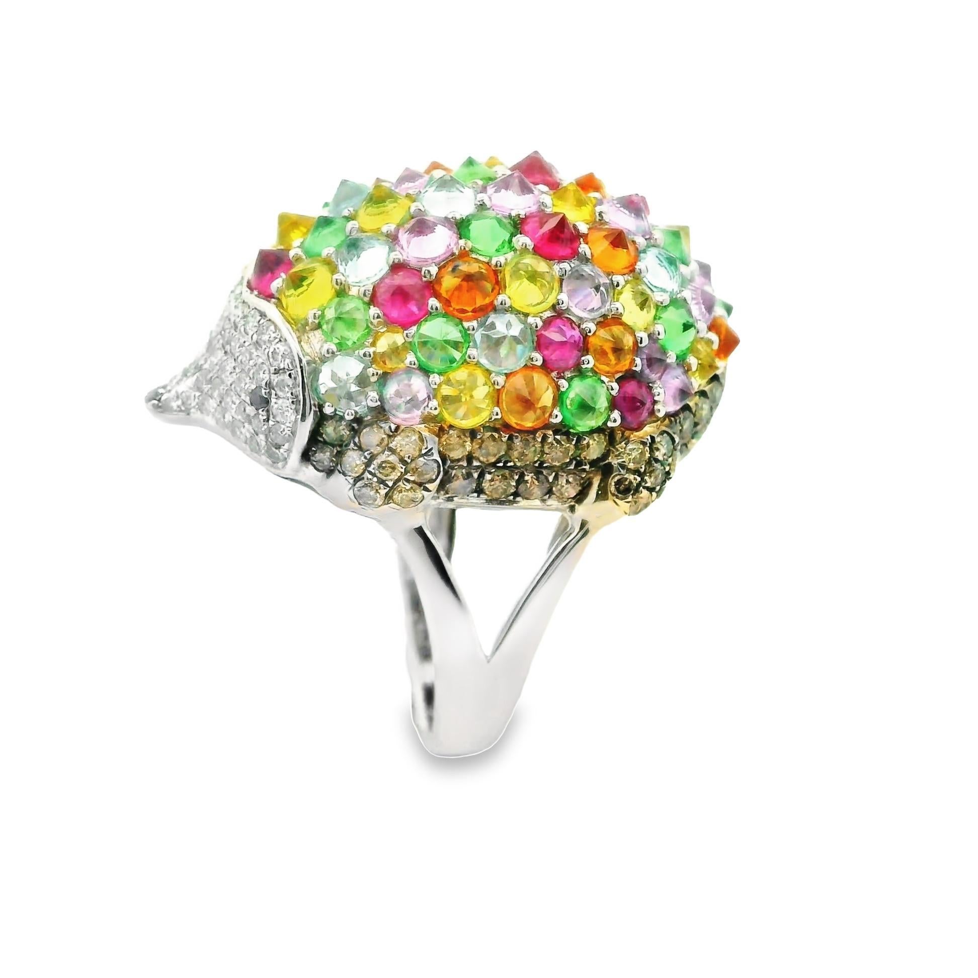 A unique piece you should own! A lovely formed hedgehog featuring 5.10 carats of round multi-color gemstone which include Sapphire, Ruby, and Tsavorite arranged invertedly making the tops of the stones pointed. Accenting the colored gemstones are