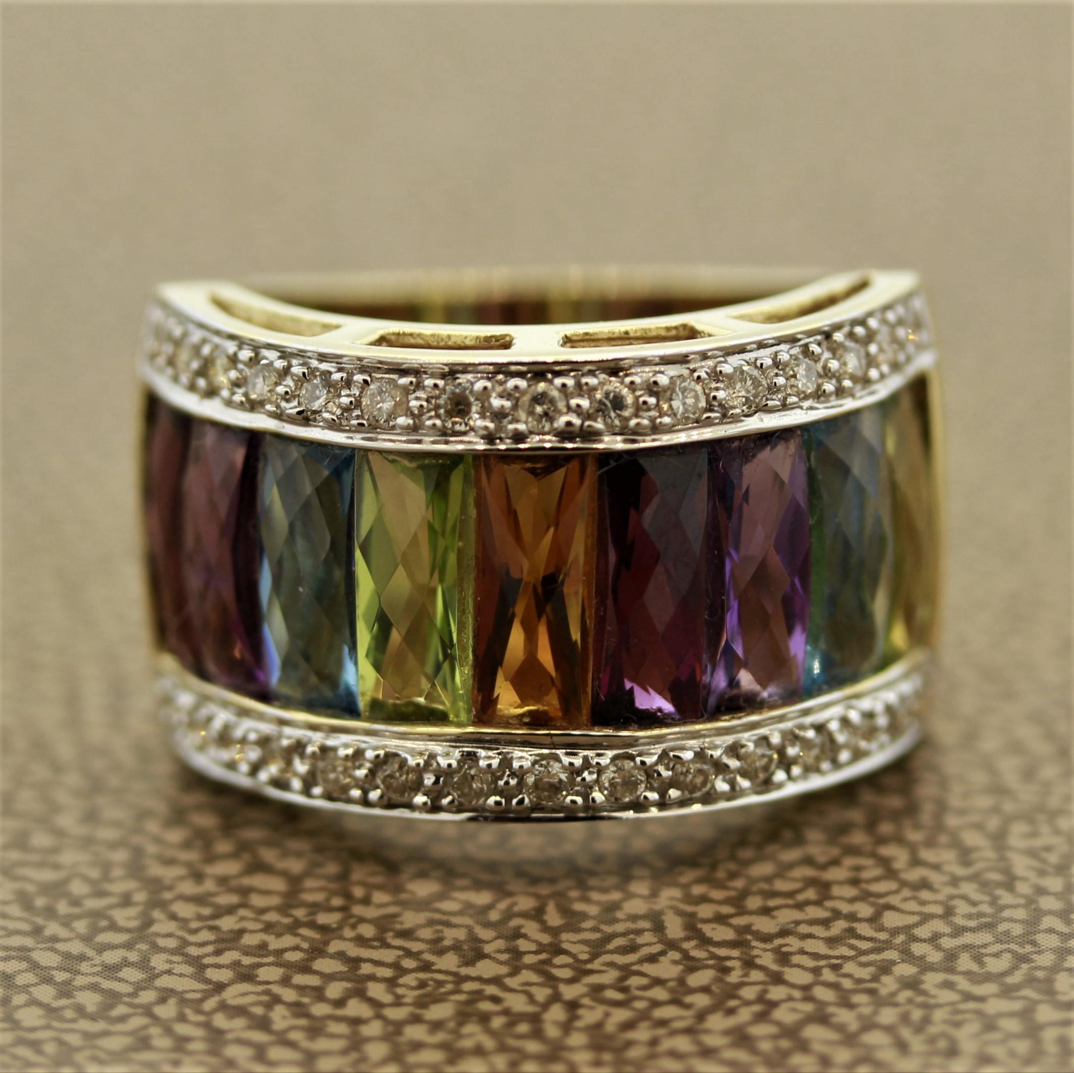 A bright and colorful wide gold band ring. It features approximately 6.50 carats of colored stones and diamonds which include amethyst, garnet, peridot and citrine. Made in 14k yellow gold.

Ring Size 6