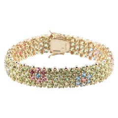 Bracciale in oro giallo 14 carati con gemme multicolore e disegno floreale