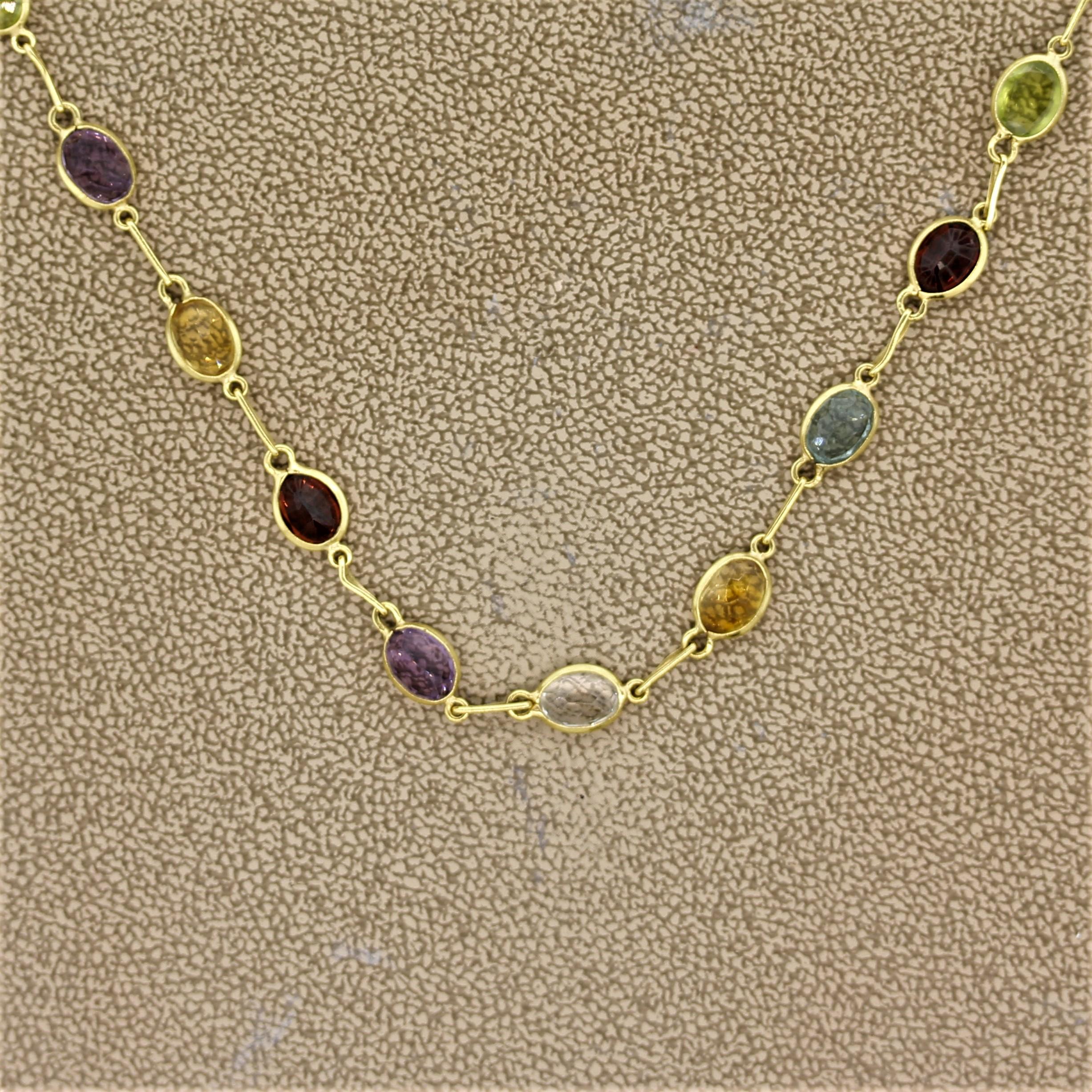 A colorful yet simple necklace featuring multi-color gemstones which include peridot, garnet, citrine, amethyst, and topaz! Each gemstone is bezel set about a quarter inch from one another. Made in 18k yellow gold.

Length: 16 inches