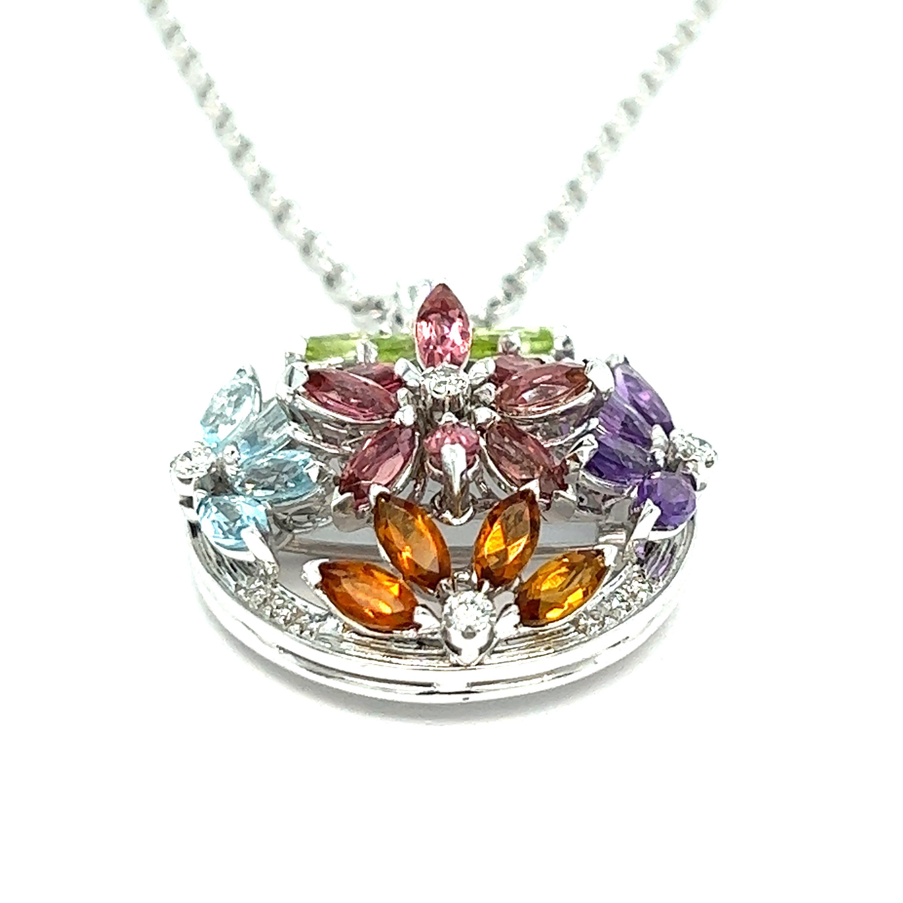 Multi-color gemstones pendant necklace, made in Italy

Marquise-shaped gemstones of aquamarine, citrine, amethyst, peridot, and tourmaline; round-cut diamonds; 18 karat white gold; marked 750, made in Italy

Size: pendant width 1 inch, length 1.25