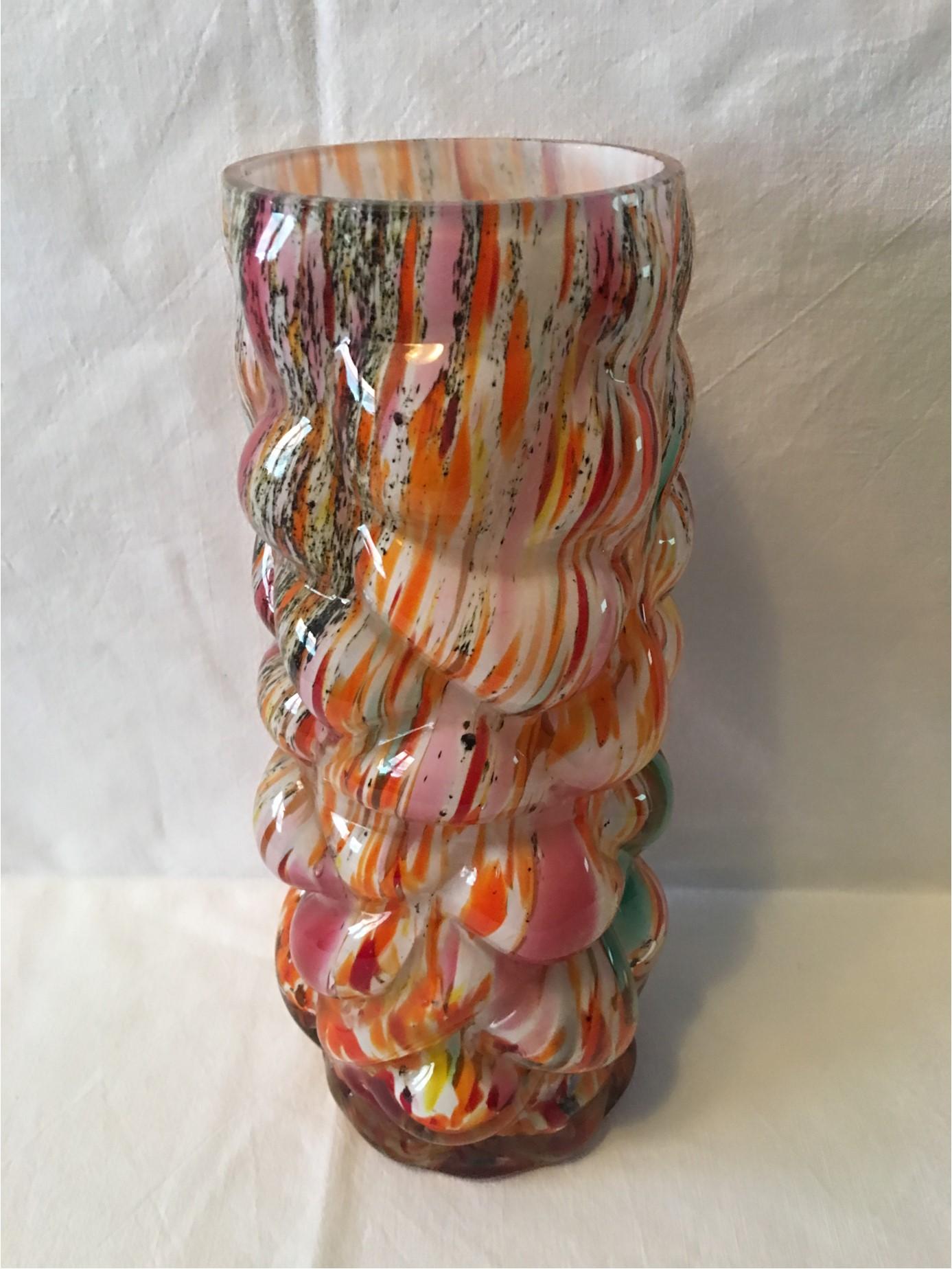 A beautiful multicolored Vase from the famous Murano glass company of Italy. From the 1960s, this vase is an attractive addition to any room. It's bubble structure lends it some unique elegance sure to please the eye.