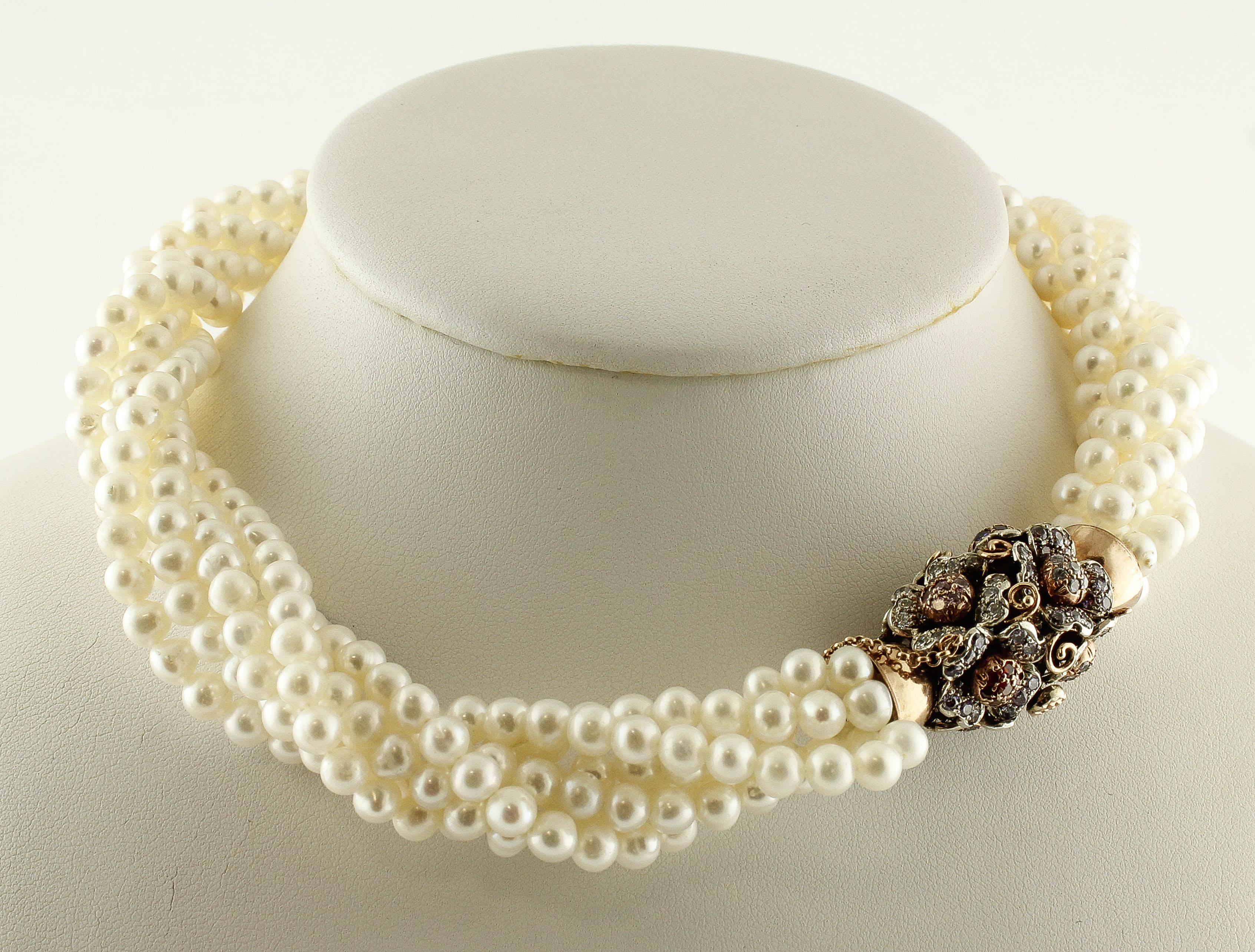 Elegant beaded necklace composed of 97.37 g of 6 white pearls rows that intertwine with each other; and 9K rose gold and silver flower theme closure adorned with 3.13 g of multi-color hard stones.
Multi-Color Hard Stones 3.13 g 
Pearls 97.37 g   / 6