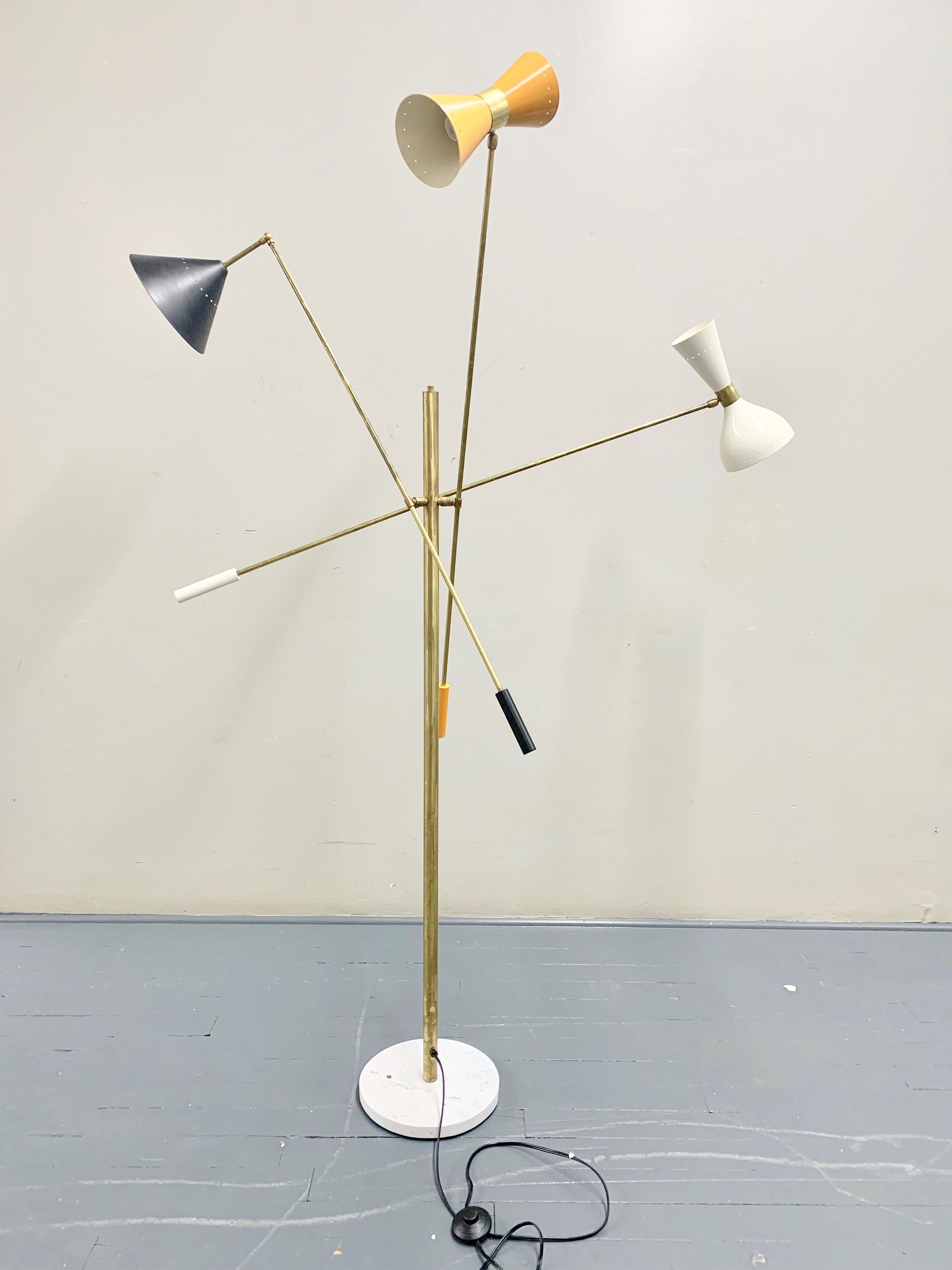 Italian midcentury style floor lamp adjustable three-arm lamp ‘Triennale’ style. Conical shades different shapes and colors, Carrara marble base, arms and body made of solid brass and hand wax painted. Each arm features counter weights of the same