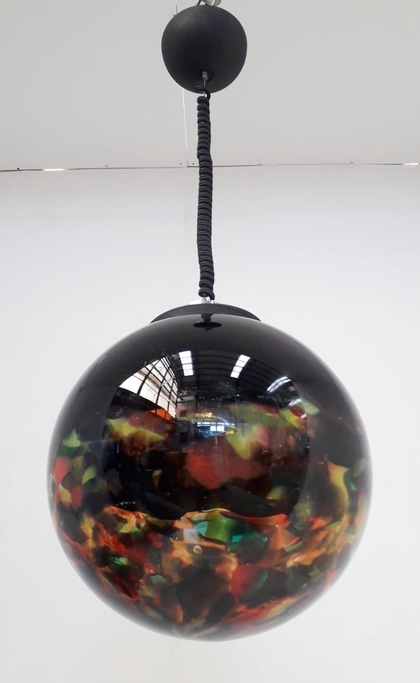 Italian Murano glass globe pendant blown with black and multicolored hemispheres / Made in Italy circa 1960s
Single light / E26 or E27 type / max 60W
Diameter 14 inches / height 14 inches plus adjustable cable and canopy
1 in stock in Italy
Order