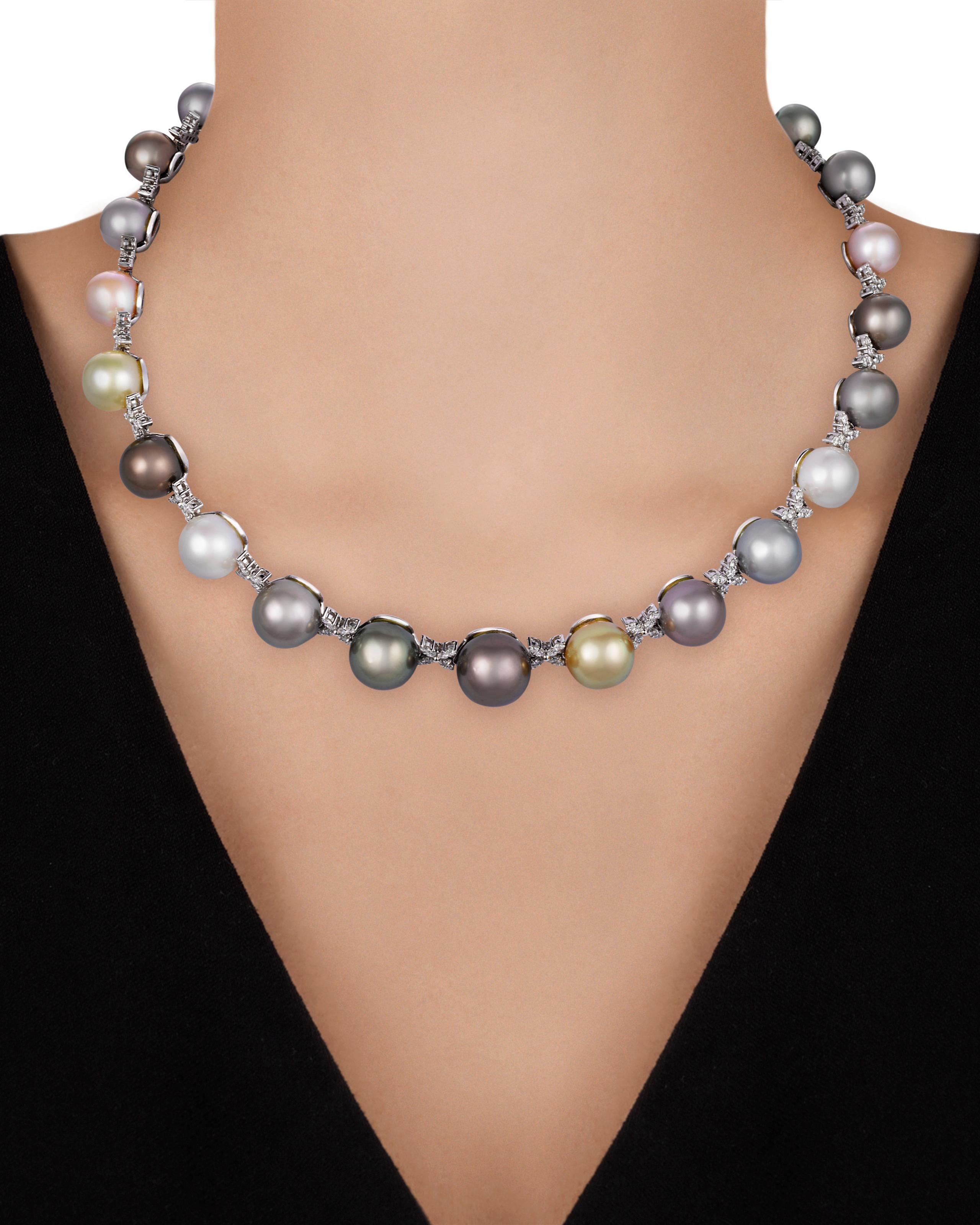 Outstanding in quality and design, this single strand of pearls exhibits a wide array of colors. Displaying hues ranging from lustrous white and shades of gray to deep black and vibrant golds, these large pearls radiate from within. Each of the 14