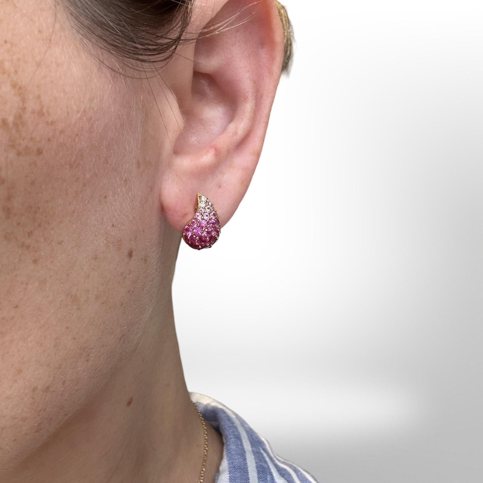 Style: Teardrop earrings
Material: Yellow Gold
Metal Purity: 14k
Stones: Pink Sapphires and Diamonds
Total Item Weight (grams): 9.2
Dimensions: 15 mm x 13 mm