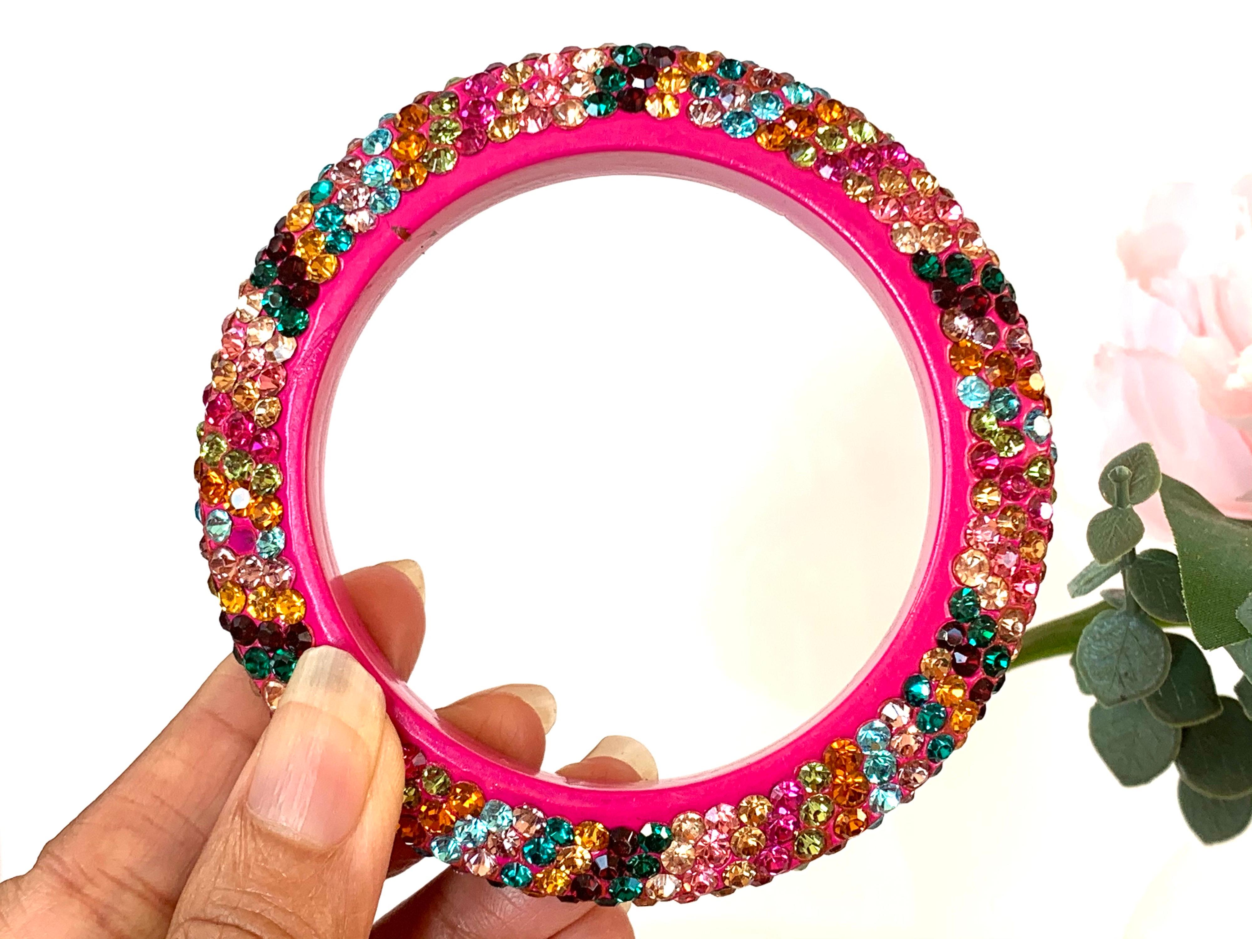 Handmade slip on bangle embellished with multi color sparkling rhinestones. Inner diameter 65.00 mm (2.56 in), inner circumference 204.2 mm (8.04 in). 

FOLLOW MEGHNA JEWELS storefront to view the latest collection & exclusive pieces. Meghna Jewels