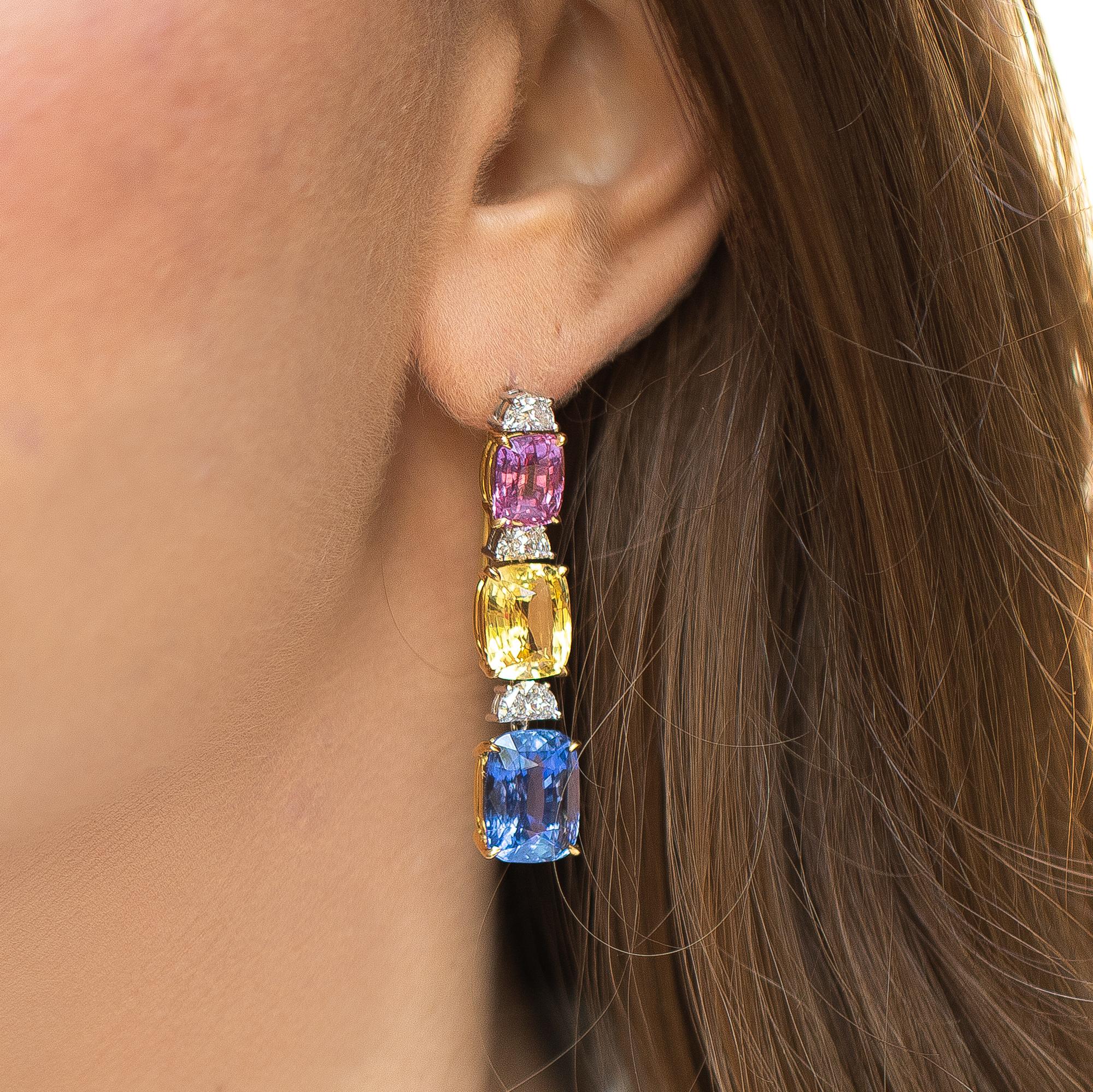These beautiful earrings with its bright colors are the perfect accompaniment to every occasion, and will automatically become the star of the show. 
Blue Sapphire = 10 carats
Pink Sapphire = 5.8 carats
Yellow Sapphire = 10 carats
Diamonds = 1.6