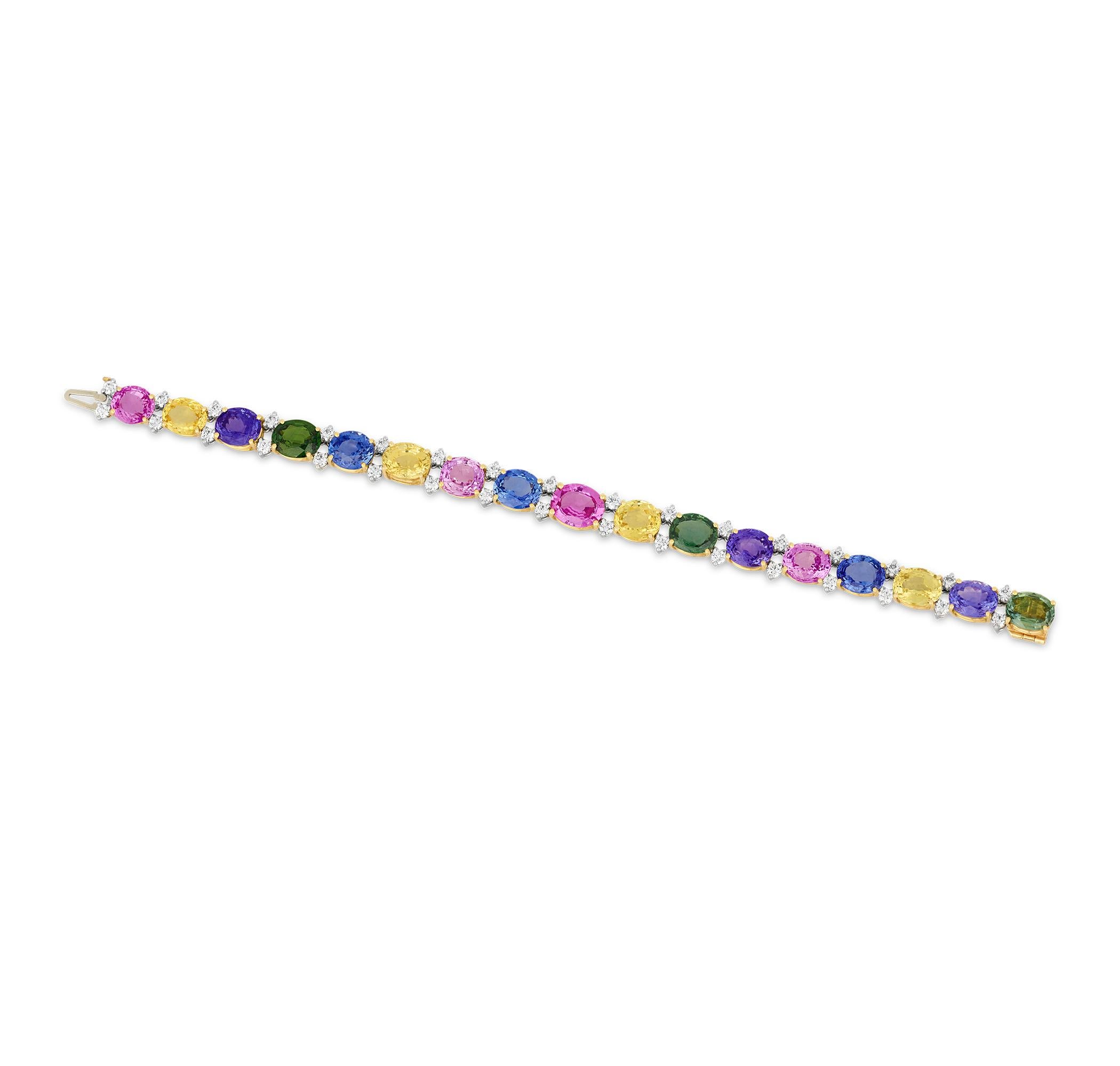 This exceptional bracelet features an array of multi-colored sapphires complemented by dazzling diamonds. The 17 sapphires, totaling an impressive 43.49 carats, offer a rainbow of vibrant, perfectly matched hues, including deep ocean blues, lush