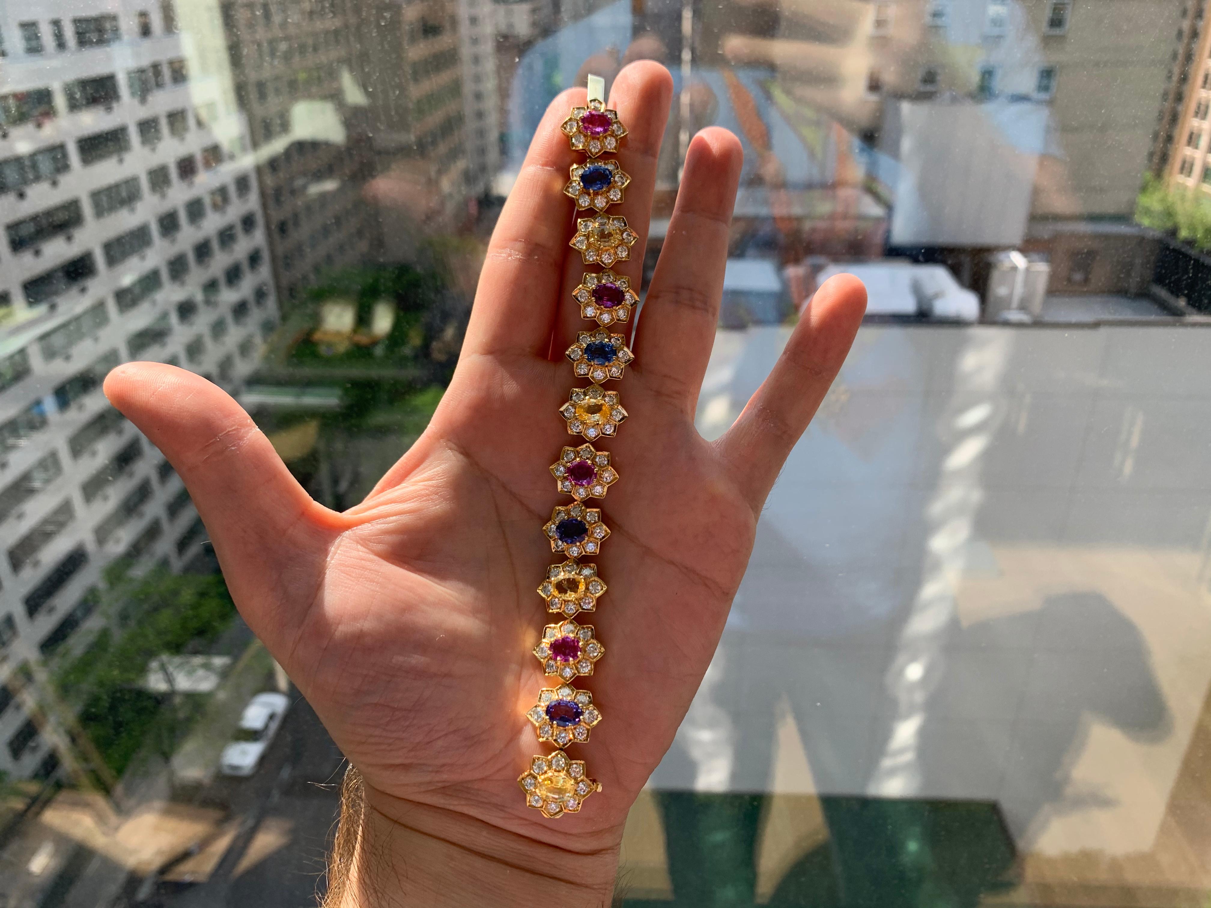 Multi Color Sapphire and Diamond bracelet

12 floral sections with 96 round diamonds approx 8.55 ct and 4 oval yellow sapphires app 5.44 ct and 4 oval sapphires app 5.93 ct and oval rubies app 5.14 ct

Made Circa 1970
Approx 6.75 inches long
18K