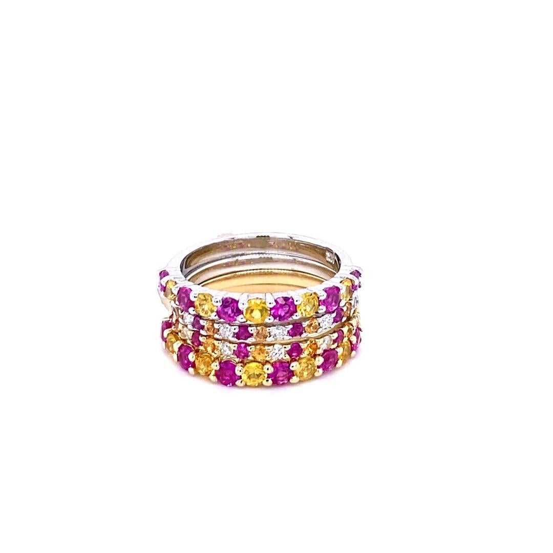 Set of 4 elegant and classy 2.90 Carat Sapphire and Diamond bands that are sure to be a great addition to your accessory collection! 
There are 42 Round Cut Yellow and Pink Sapphires that weigh a total of 2.70 Carats in all 4 Bands and 10 Round Cut