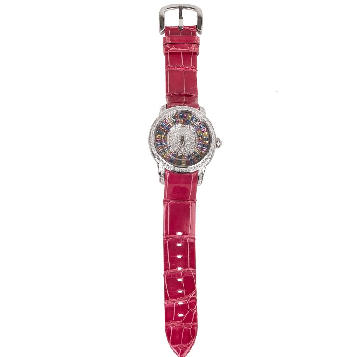 This watch features multi-color sapphire baguettes and round cut diamonds embedded on the face of the watch.  This watch features automatic movement and is made with stainless steel and fine leather.