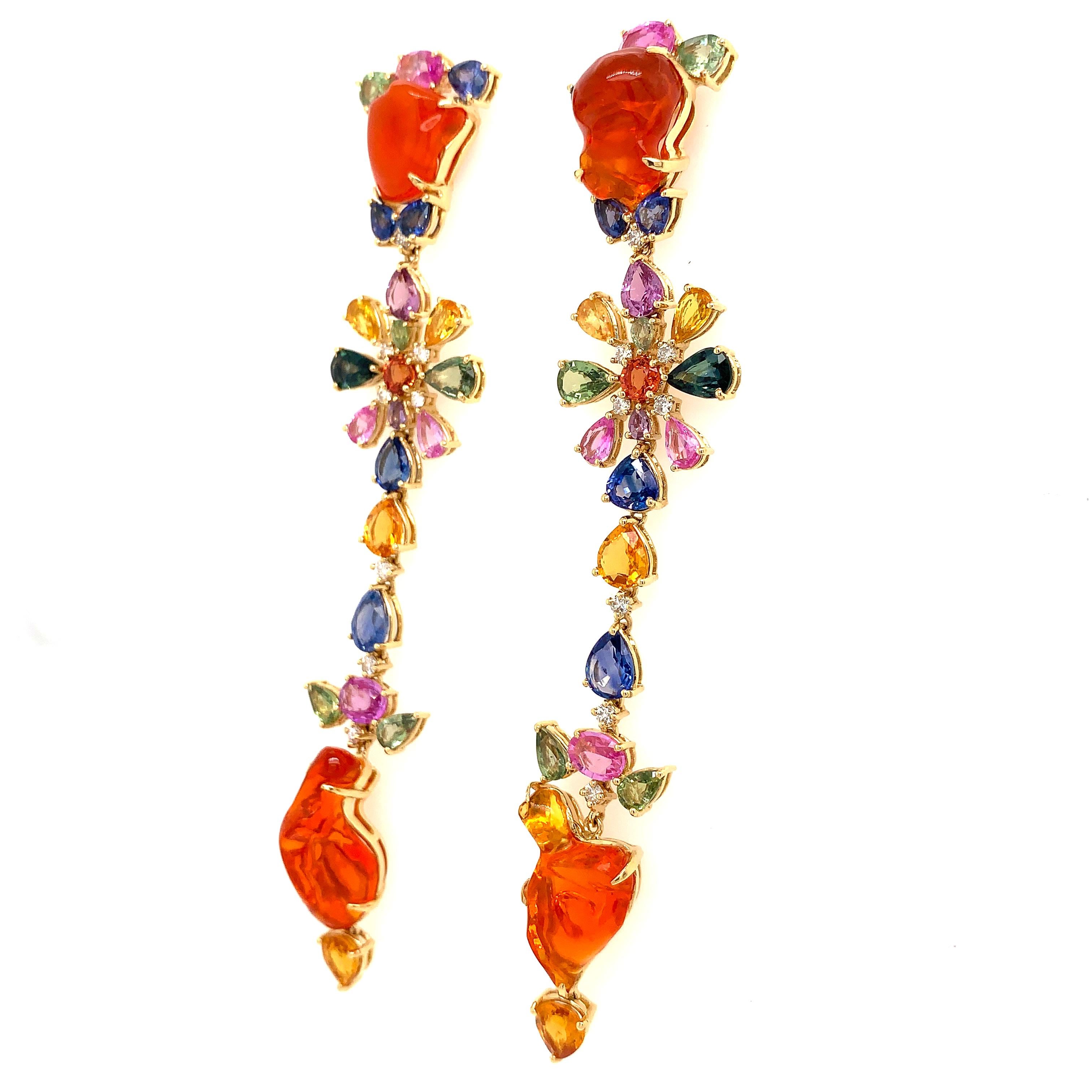 Bursts of Lava Collection

Fire Opal, multi color Sapphires (pink, orange, blue, green and purple) and Diamond drop earrings set in 18K yellow gold in a floral design.

Fire Opal: 15.20ct total weight.
Color Sapphire: 15.06ct total weight.
Diamonds: