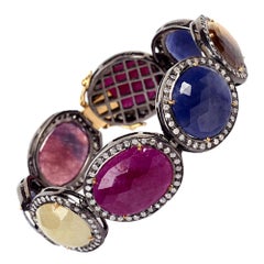 Bracciale tennis multicolore con zaffiri e rubini e diamanti incastonati in oro e argento