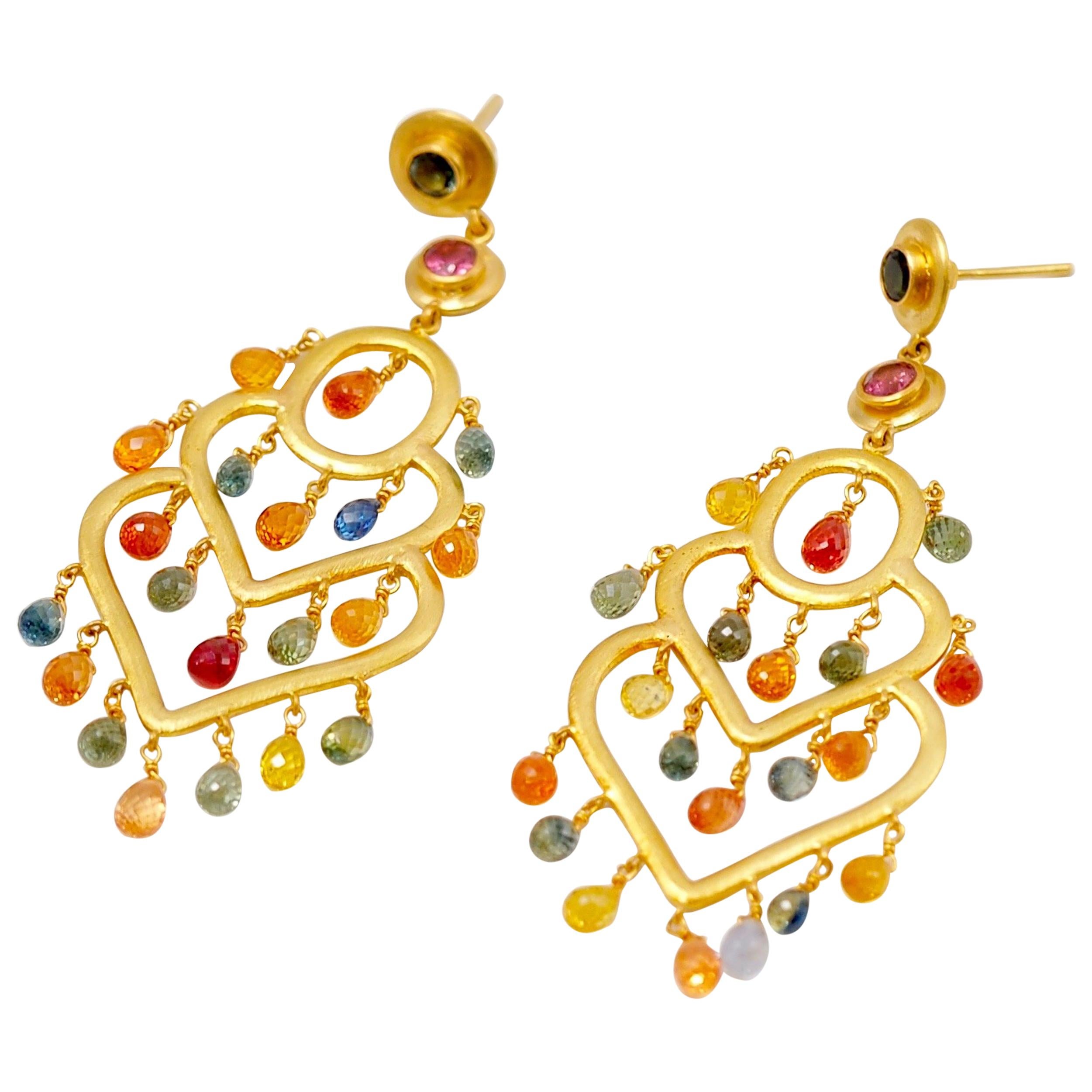 These chandelier earrings are composed of 2 round tourmalines (one pink and one green) at the part of the earring and of 20 briolette drops of natural multicolour sapphires (around 12carats). 
The colours of the sapphires are yellow, orange, red,