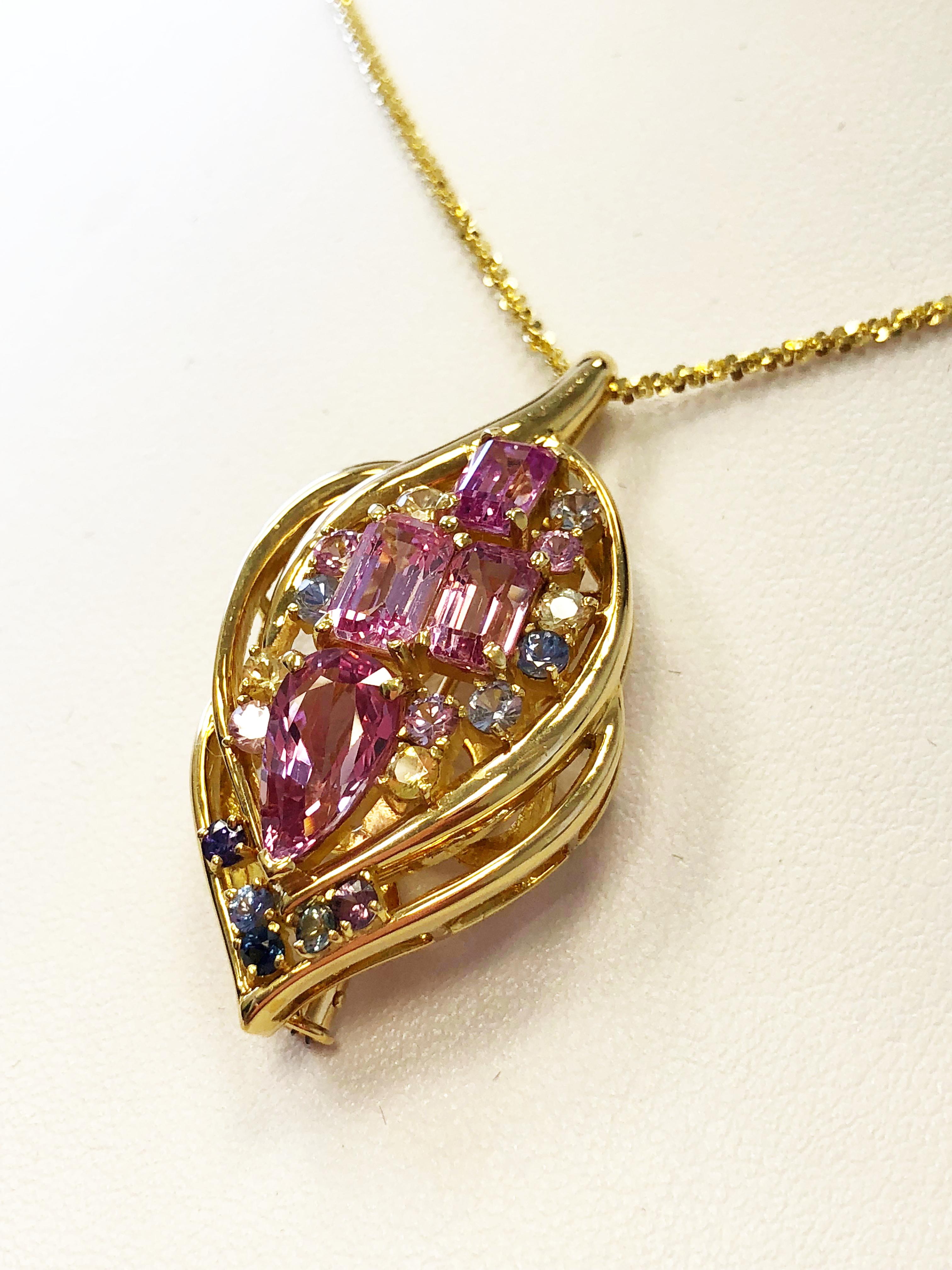 A beautiful cluster of multicolor and multi shape sapphires in this dangle pendant 18k yellow gold necklace.  Pink sapphires weight 6.27 carats and multi color sapphires weigh 1.49 carats in 22