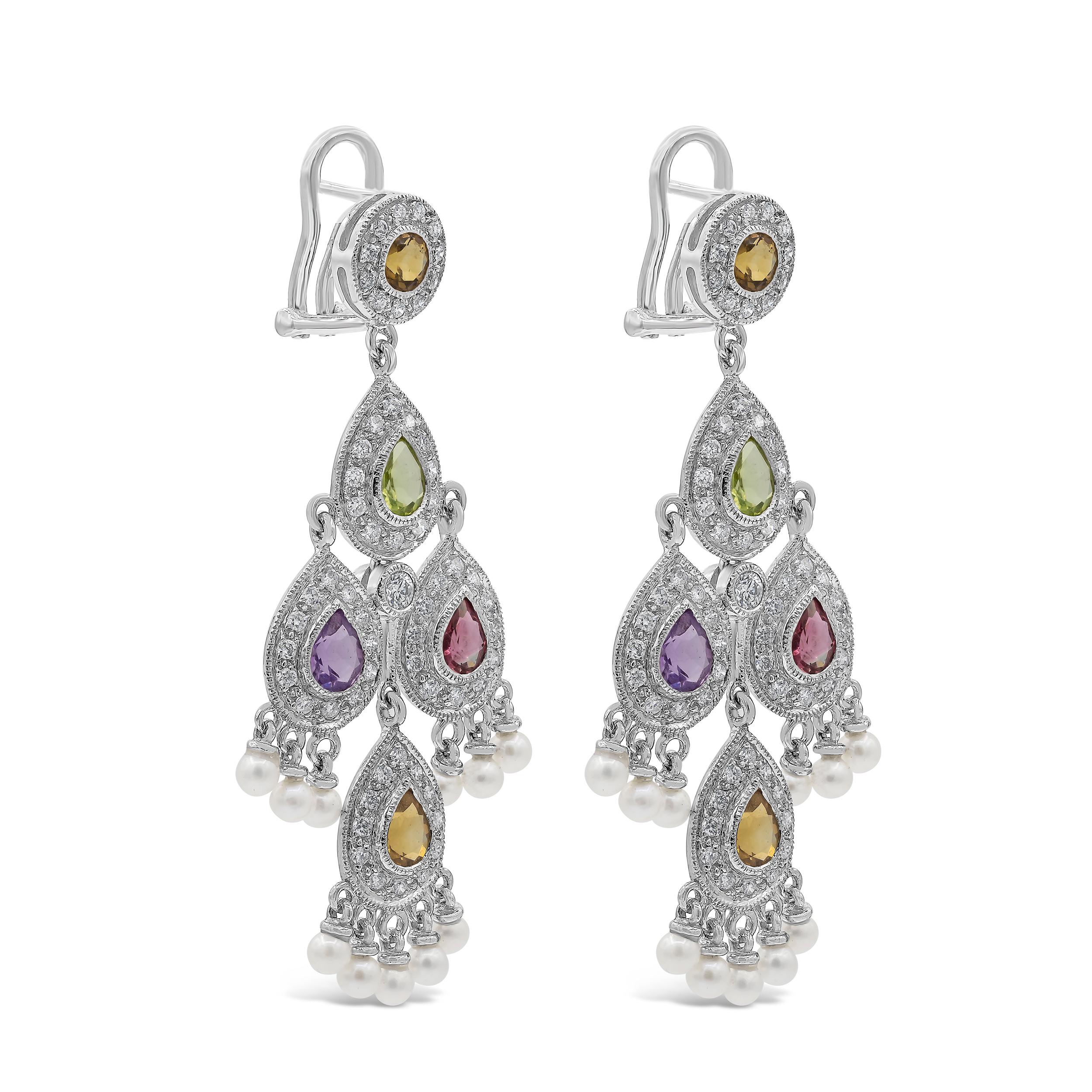 A beautiful pair of chandelier earrings, showcasing pear shape multi-color sapphires weighing 2.83 carats total, bezel-set with milgrain edges. Surrounded by a halo of round cut diamonds weighing 1.19 carats total and accented by small dangling