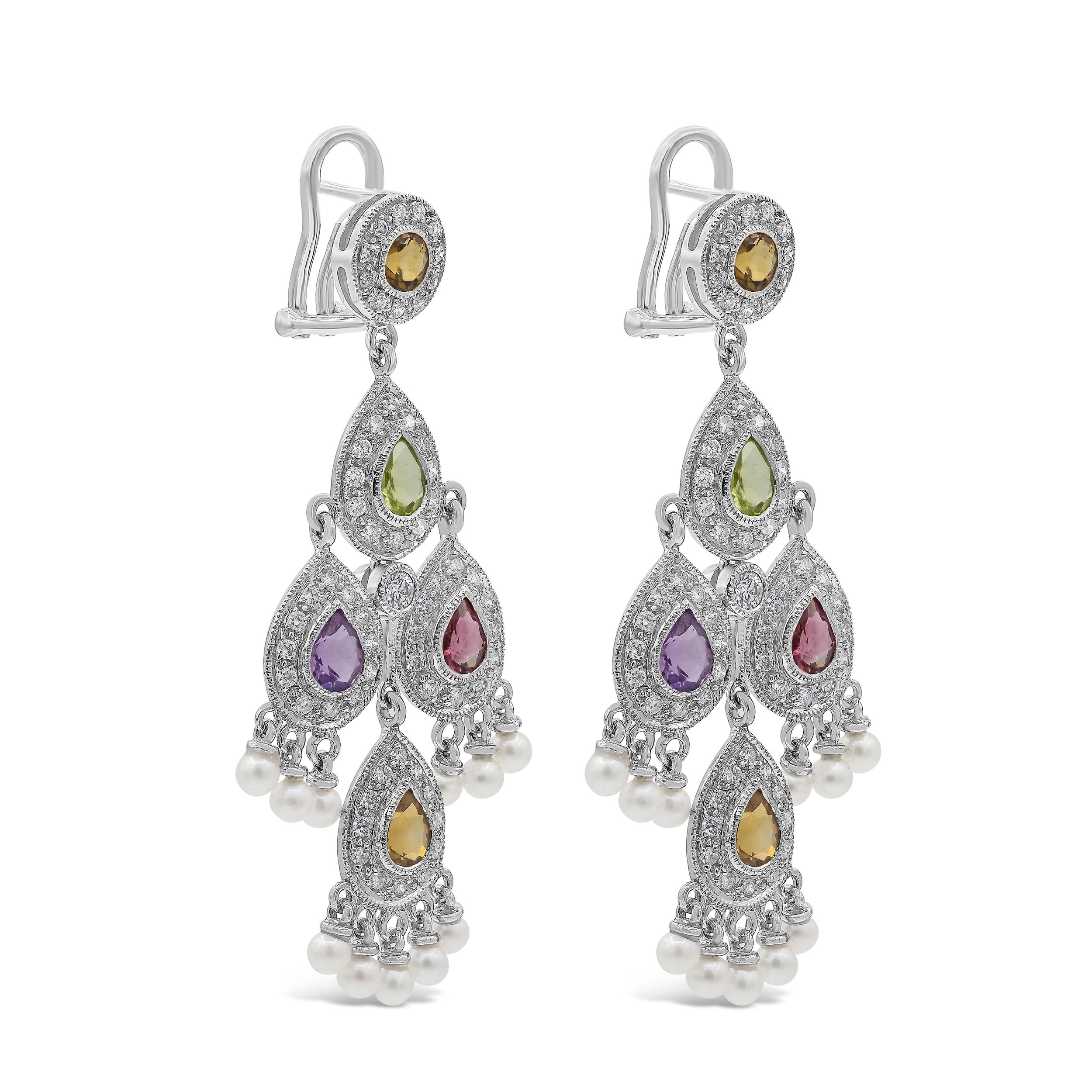 A beautiful color-rich chandelier earrings perfect for spring and summer showcasing pear shape multi color sapphires weighing 2.83 carats total. Set in a dangle halo design with brilliant round diamonds weighing 1.19 carats total. Accented with