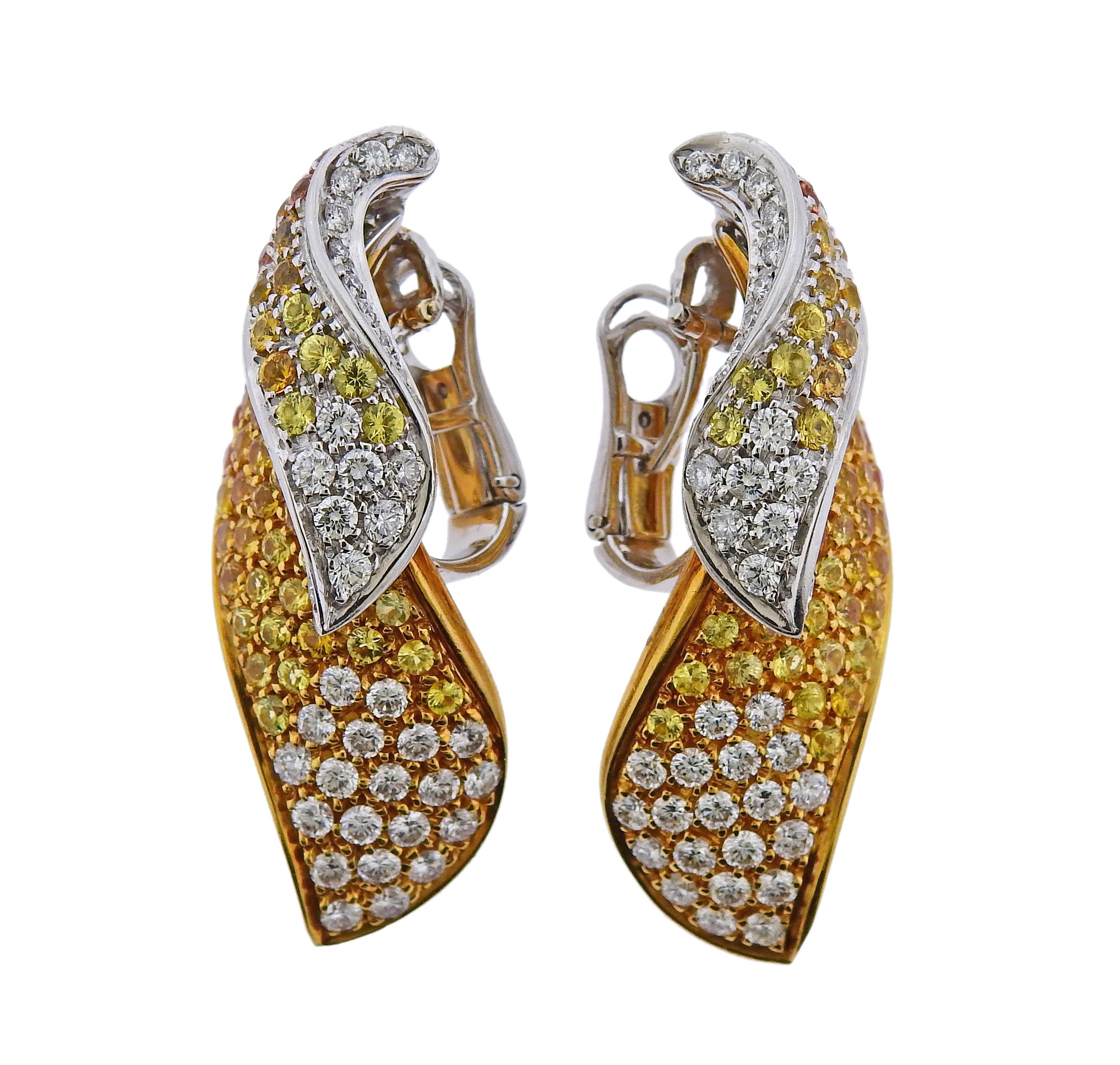 Pair of 18k white and yellow gold earrings, adorned with approx. 5.90ctw in yellow and orange sapphires, and 3.00ctw in G/VS diamonds. Earrings are 41mm x 18mm, with collapsible posts. Weight is 31.5 grams. Marked Dal Lago 750. 