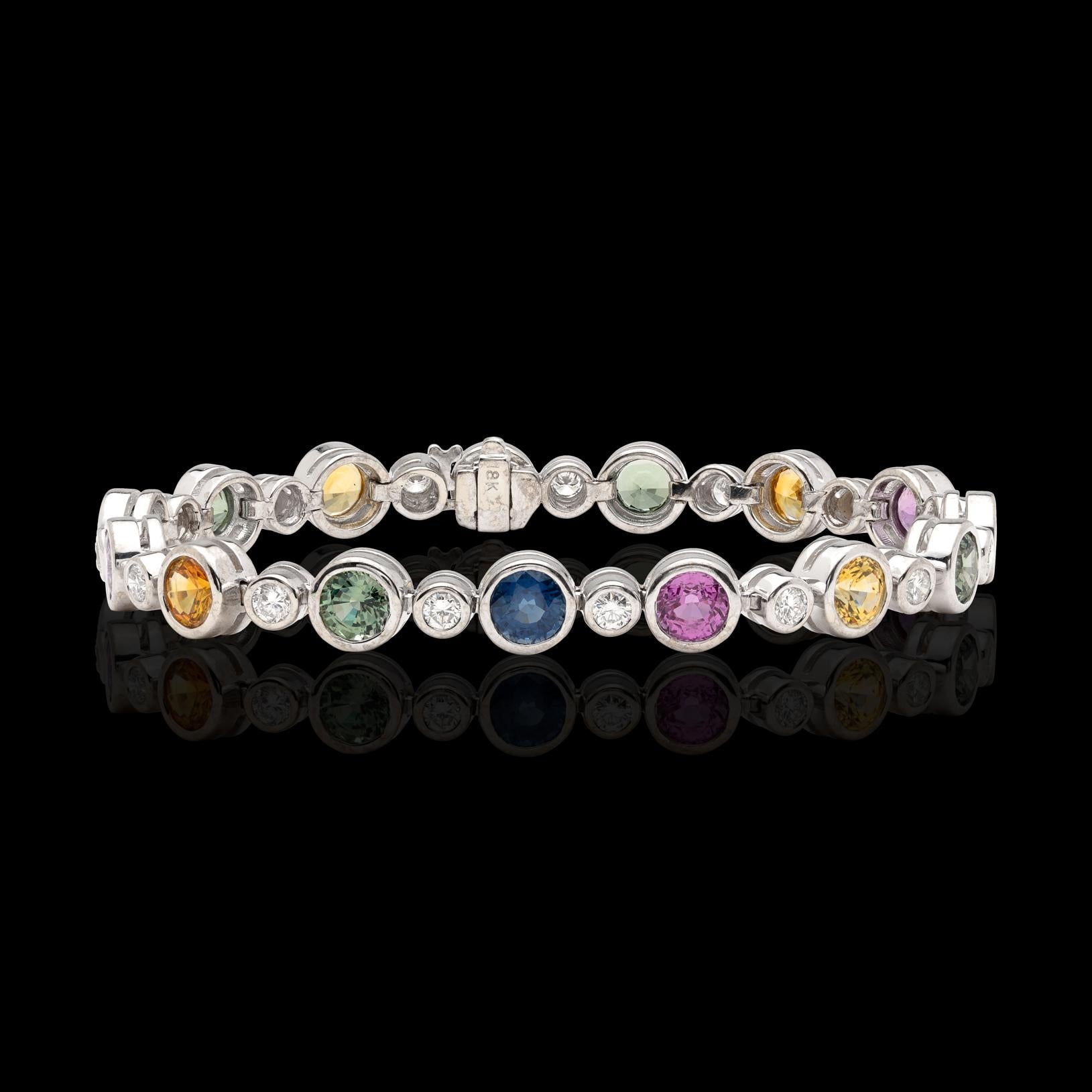 Colorful and contemporary, this link bracelet hits all the notes! With 15 bezel-set 1.00-ct. round sapphires ranging from blue, pink, and green to yellow (15 carats total weight!), and alternating with bezel-set round brilliant-cut diamonds, the