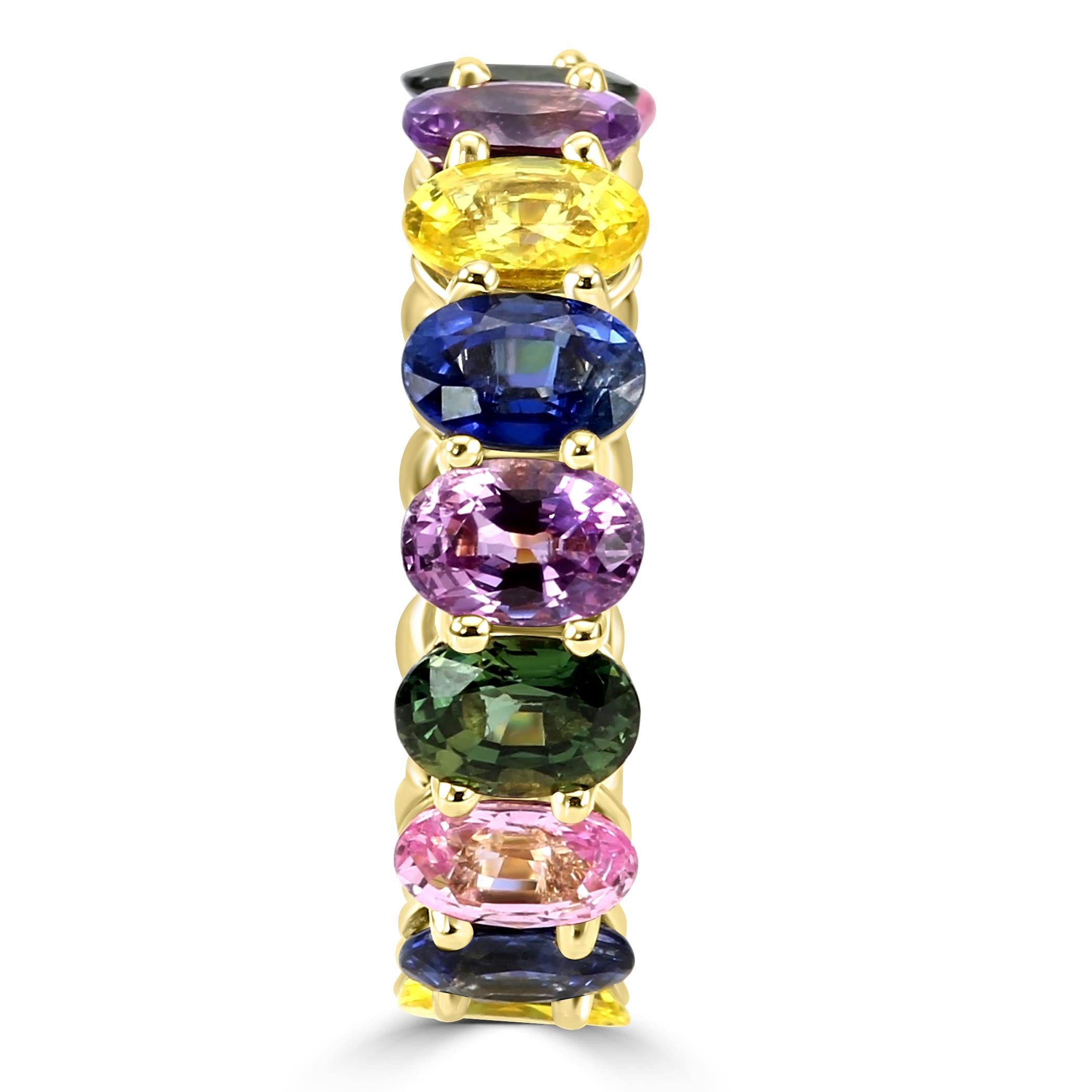 Behold our vibrant & stunning fashion eternity ring, a true celebration of color and elegance. This fine piece features a dazzling array of multi-color sapphires totaling to 10.93 carats, each stone precisely selected & set for its brilliance and