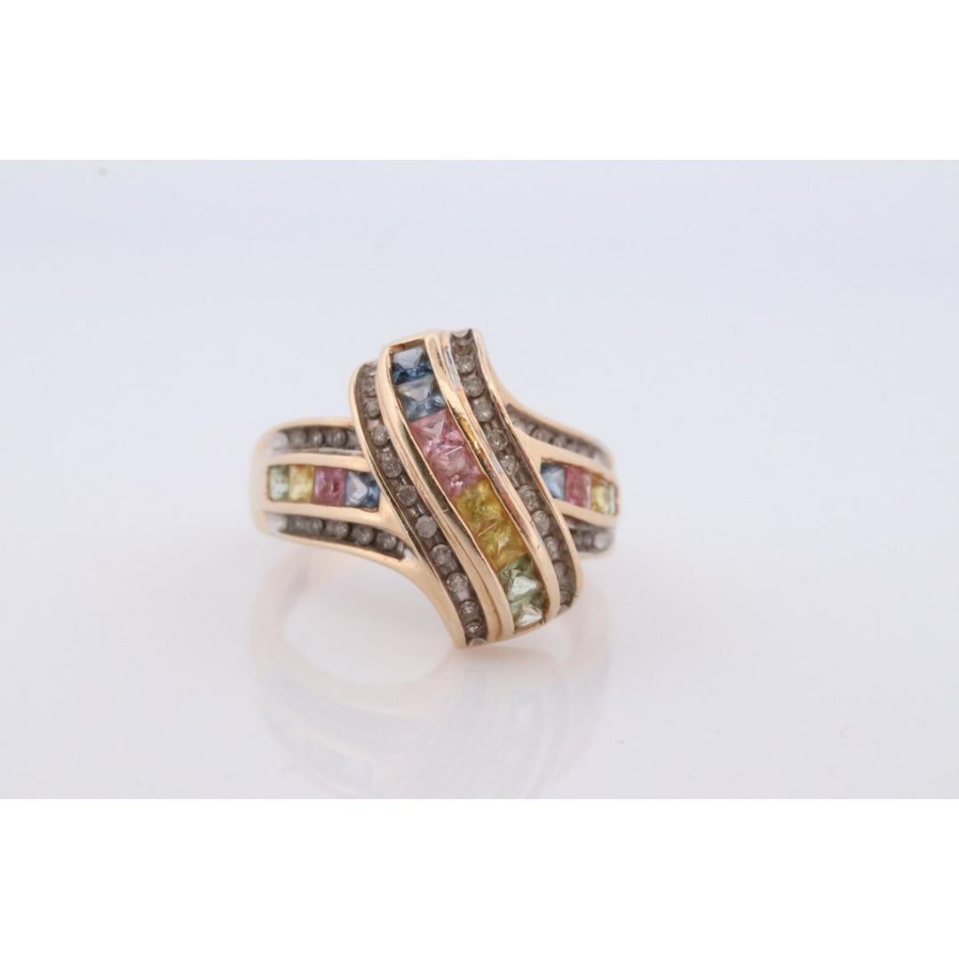 Vintage
Size: 7 US
Materials: Stone
Gemstone: Sapphire
Gem color: Purple
Band Color: Yellow

Style: Minimalist

Very fun and colorful ring. Princess Sapphires colorful channel set. Outline with smaller diamonds.

16mm wide top
5.0 grams total
Marked