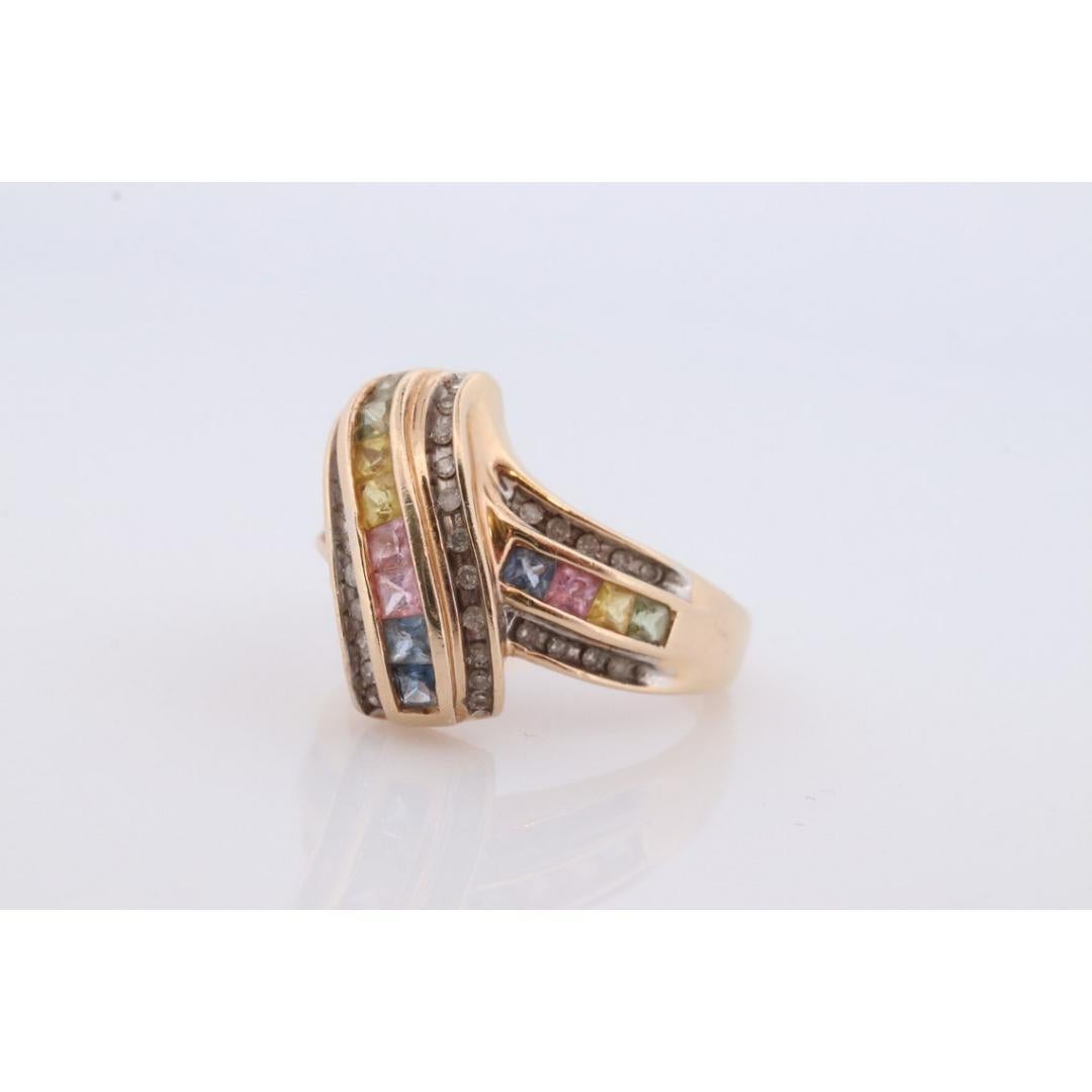Multi-Color Sapphire Ring. 14k Yellow Gold ring. Colorful Sapphire channel set. In Good Condition In Port Charlotte, FL