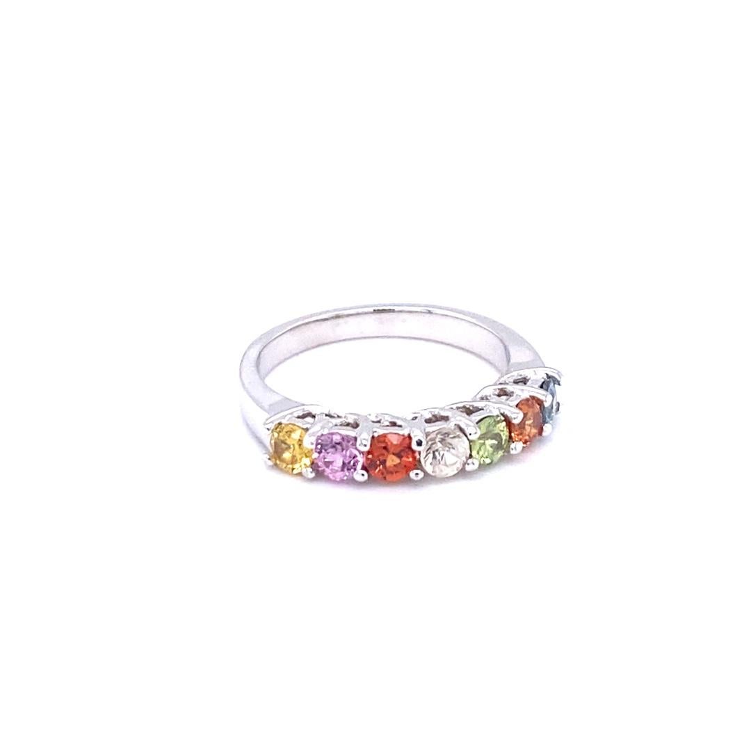 Multi Color Sapphire White Gold Band 

There are 7 Multi Color Genuine Sapphires in this band that weigh 1.31 Carats.  
It is perfect for everyday wear and looks amazing stacked or alone.  It's versatile and can jazz up to any outfit and occasion! 