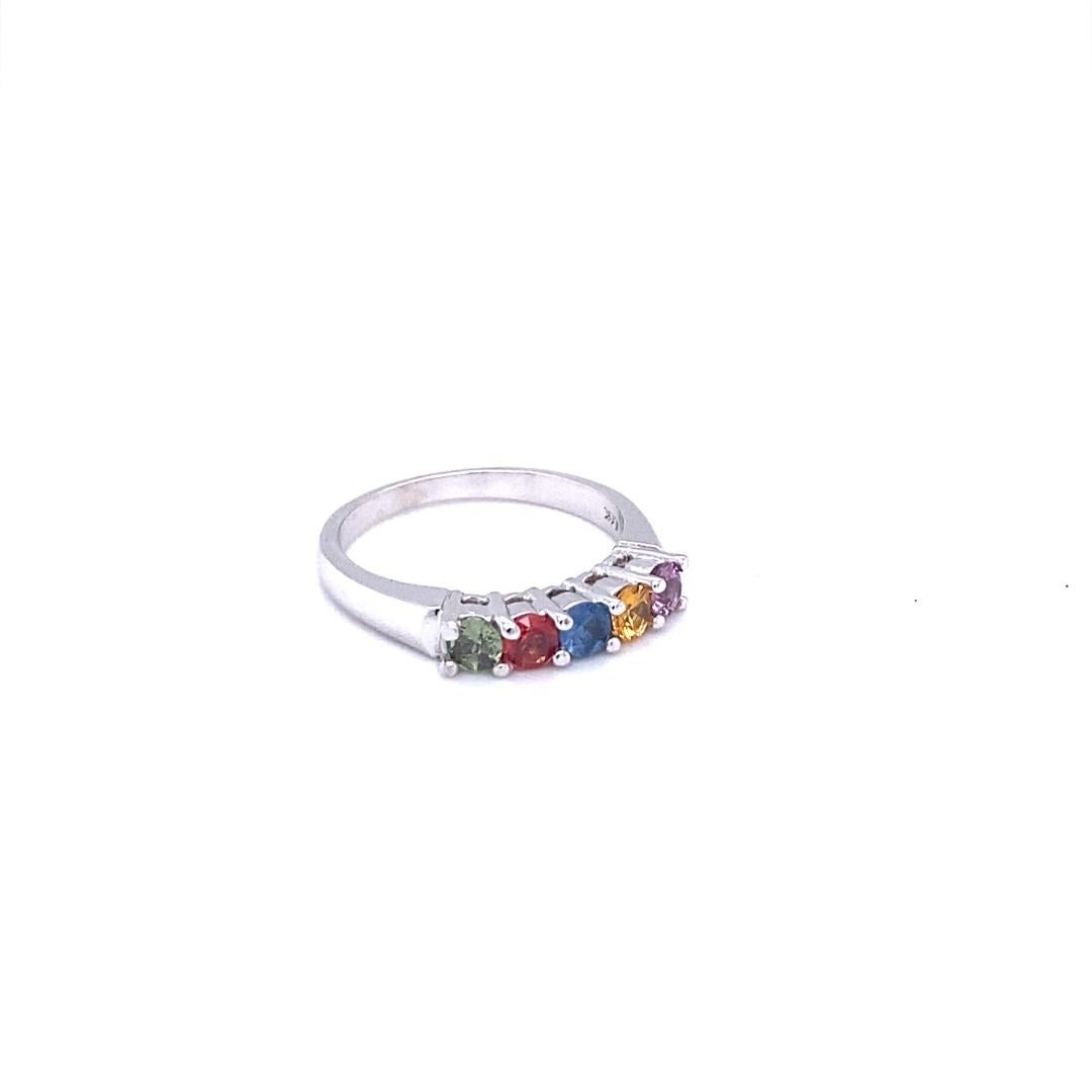 Here are 5 Multi Colored Genuine Sapphires in this band that weigh 0.86 Carats.  
It is perfect for everyday wear and looks amazing stacked or alone.  It's versatile and can jazz up to any outfit and occasion!  
This band is created in 14 White Gold