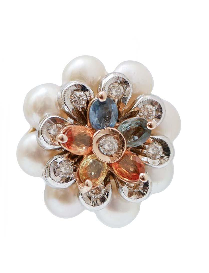 Gorgeous flower earrings in 14 karat white and rose gold structure mounted with a round of small white pearls. In the central part, a flower in white gold structure studded with diamonds and, on it, a flower in rose gold structure mounted with