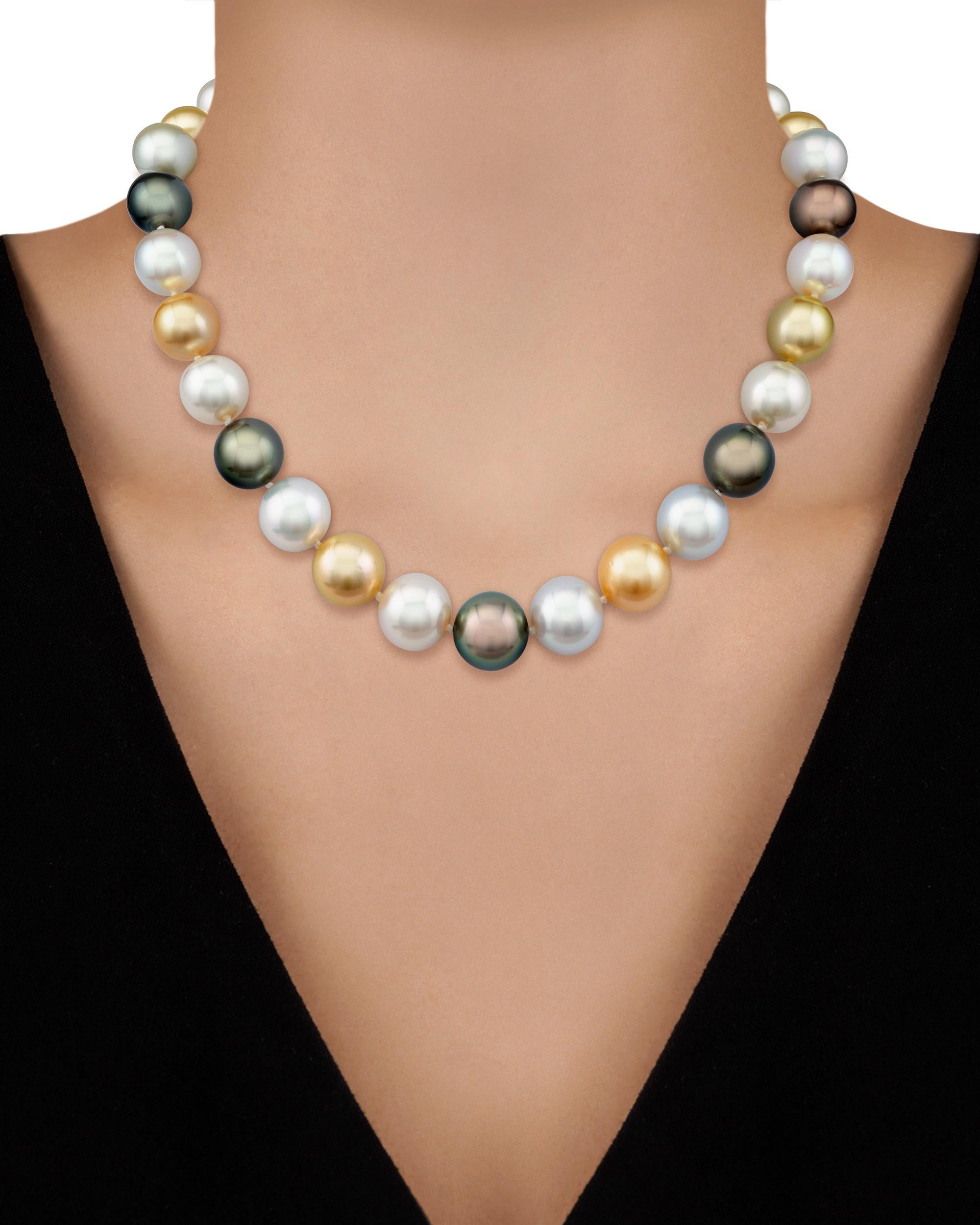 Outstanding in quality and design, this single strand of South Sea pearls exhibits the wide array of color. Exhibiting hues ranging from lustrous white and shades of gray to deep black and vibrant golds, these large pearls radiate from within and