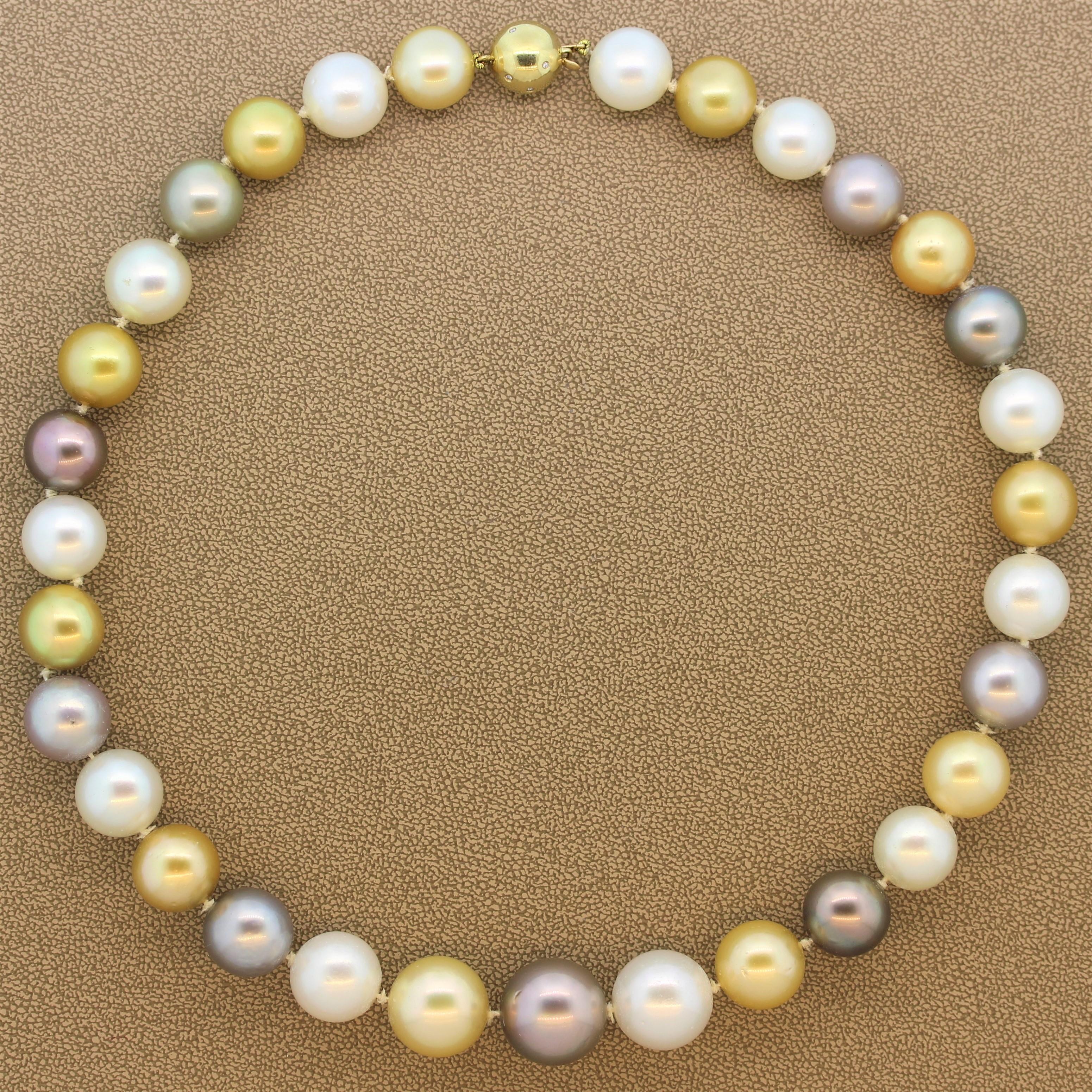 A lustrous graduating necklace featuring 17.00mm-13.00mm gold South Sea pearls, white South Sea pearls and Tahitian pearls. This single strand necklace has a secure hidden lock. A 14K yellow gold sphere, polka-dotted with 0.25 carats of bezel set