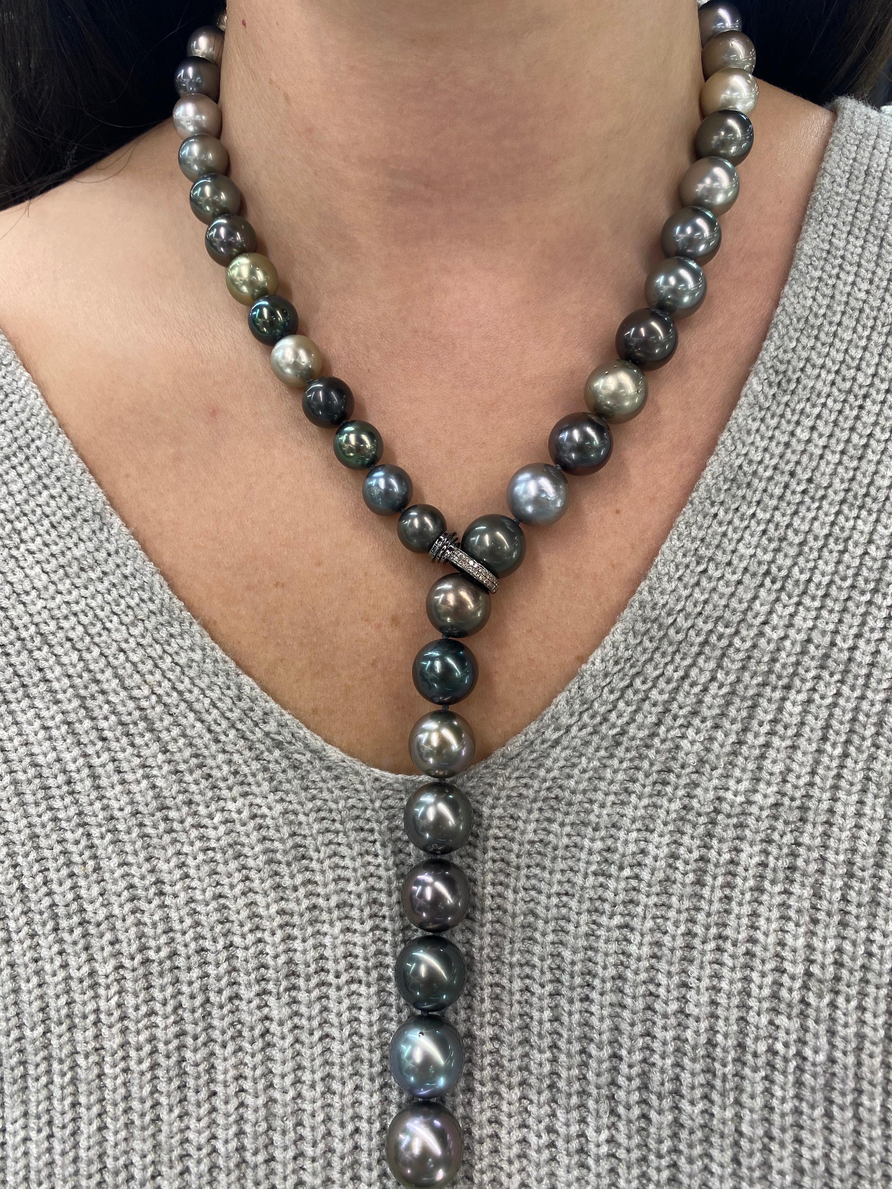 Chic South Sea Tahitian Pearl necklace featuring 36 pearls measuring 10.4-12.5 mm and a diamond front clasp. 
Pearl quality: AAA
Pearl Luster: AAA Excellent
Nacre : Very Thick

Strand can be made to order, shortened or longer. Clasp can be changed,