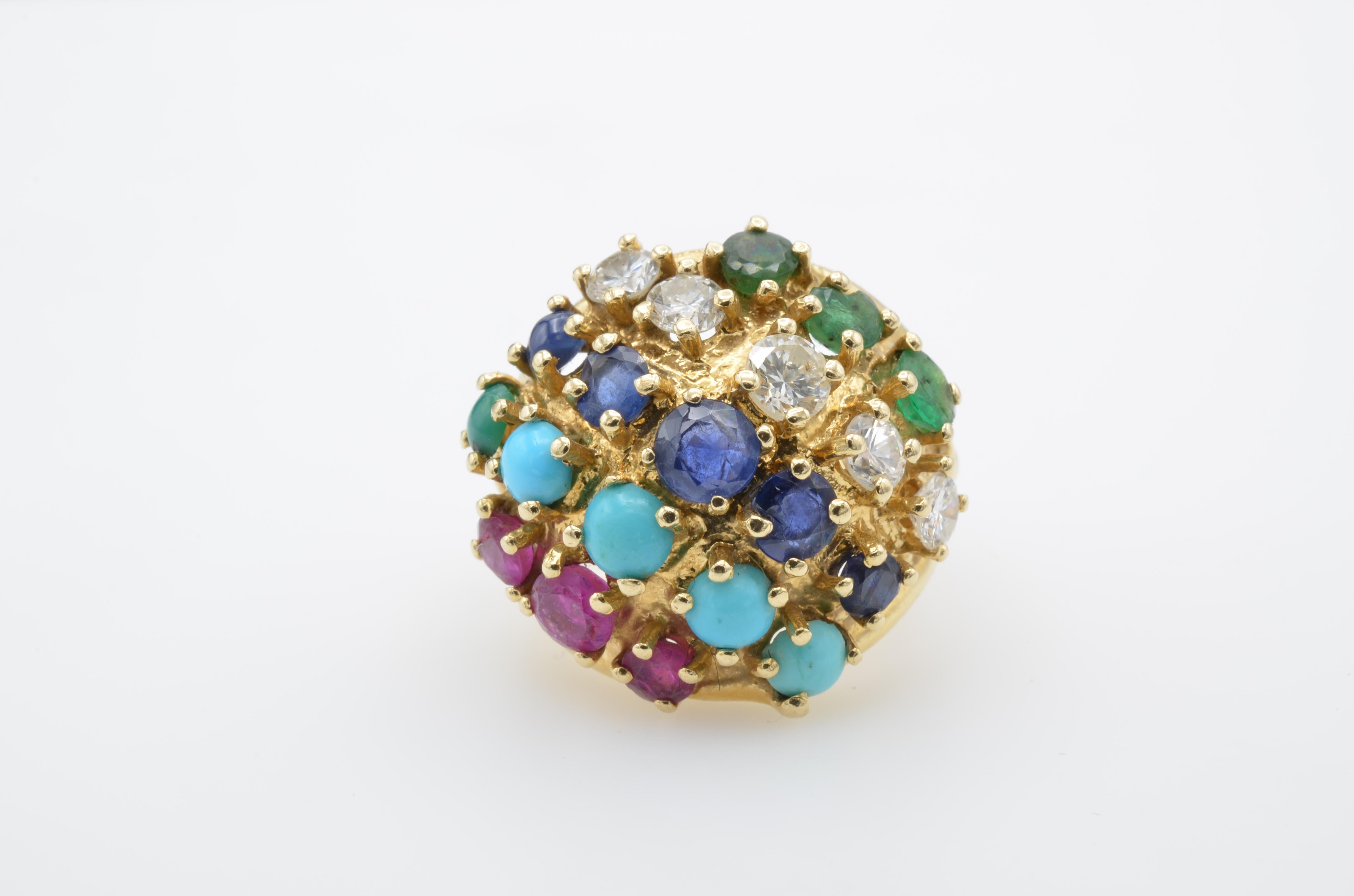 This fun and fanciful ring is a kaleidoscope of color accented with dazzling diamonds. The rubies, emeralds, sapphires and turquoise are a rainbow of color. This ring is a conversation starter and a walk down memory lane. It is a size 4 1/2 and can