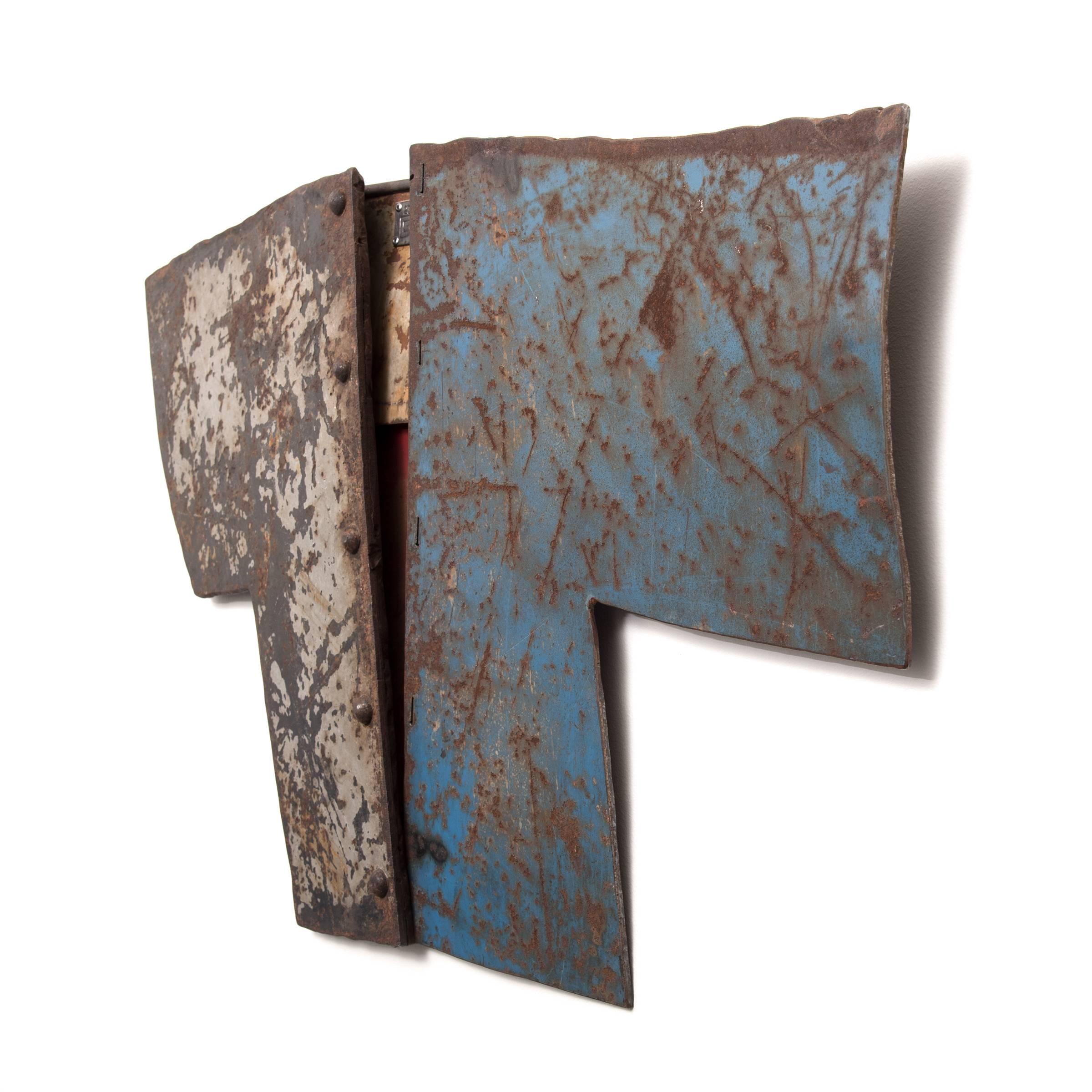 Piecing together discarded fragments of painted metal, Gordon chandler exploits the latent beauty of rusted and weathered metal in this provocative sculpture. Effaced by time and the elements, the panels that comprise this shirt-like composition