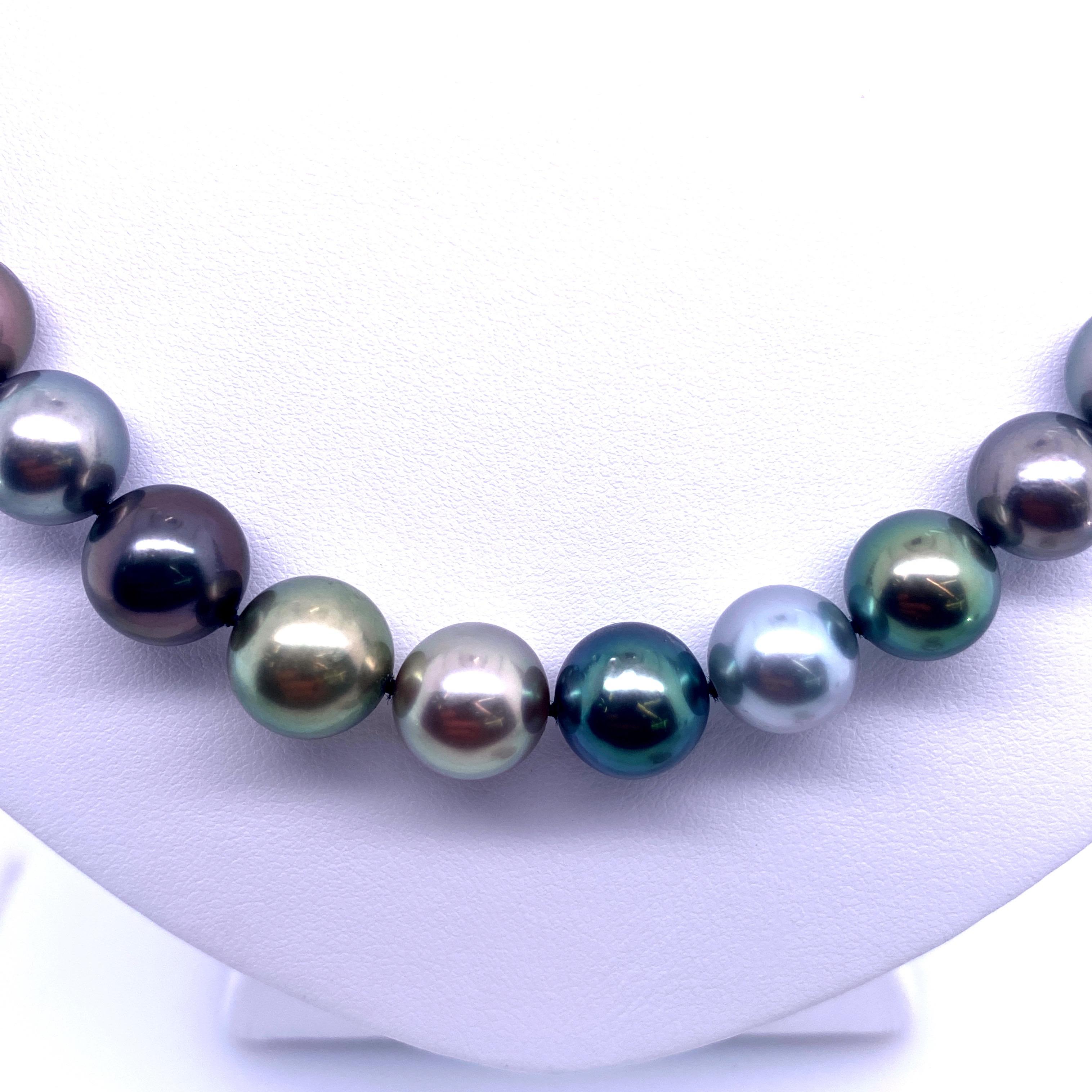 Multi-Color Tahitian pearl strand necklace featuring 41 round pearls from light grey to dark grey colors measuring 9.8-11 MM, with a 14k white gold milgrain ball clasp. 

Pearl quality: AAA
Pearl Luster: AAA Excellent
Nacre : Very Thick

Strand can