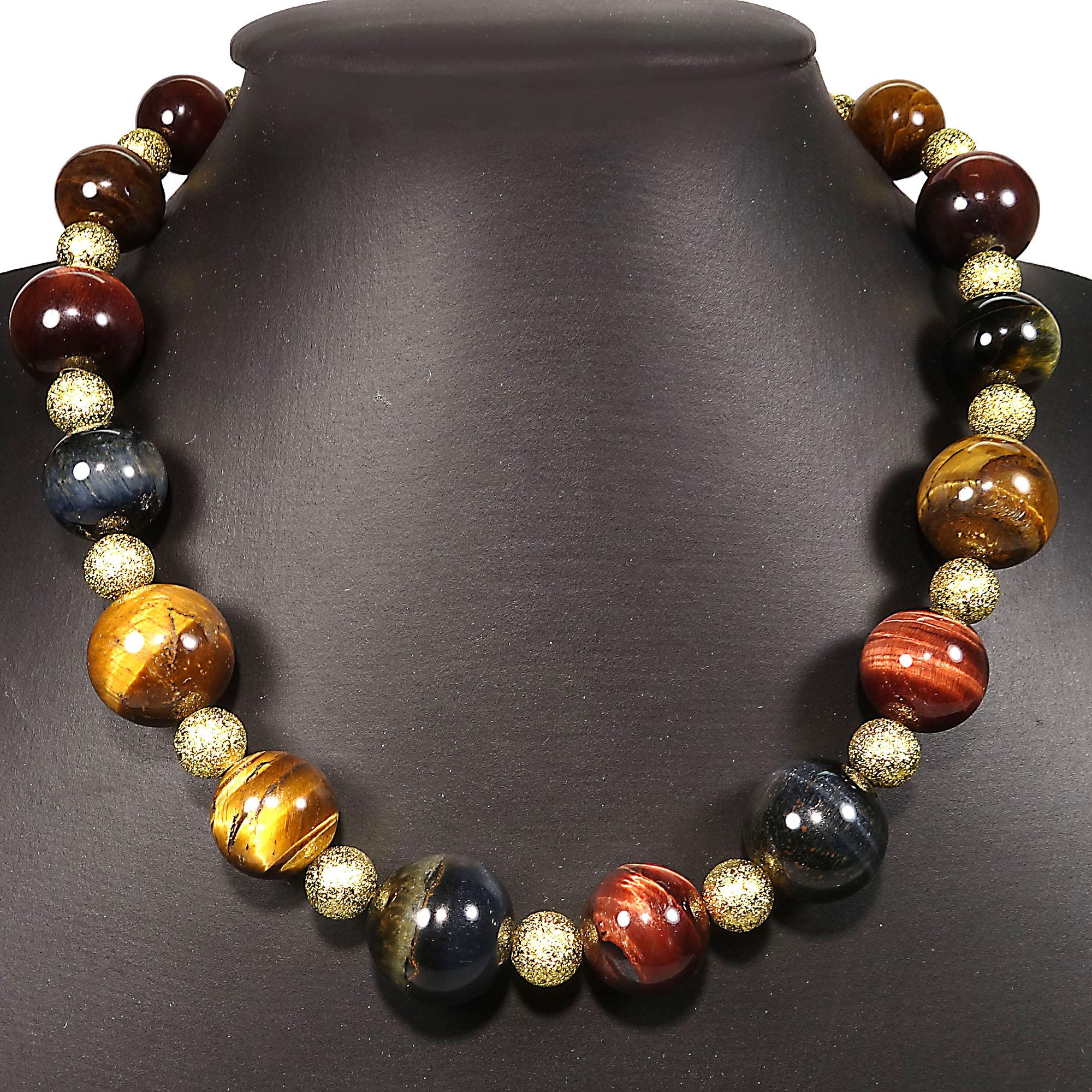 Elegant, multi color Tiger's Eye necklace in chatoyant shades of red, blue, and brown. This handmade necklace is so perfect for all occasions with the two sizes of Tiger's Eye and frosted gold tone spacers.  It is 16 inches in length and just sits