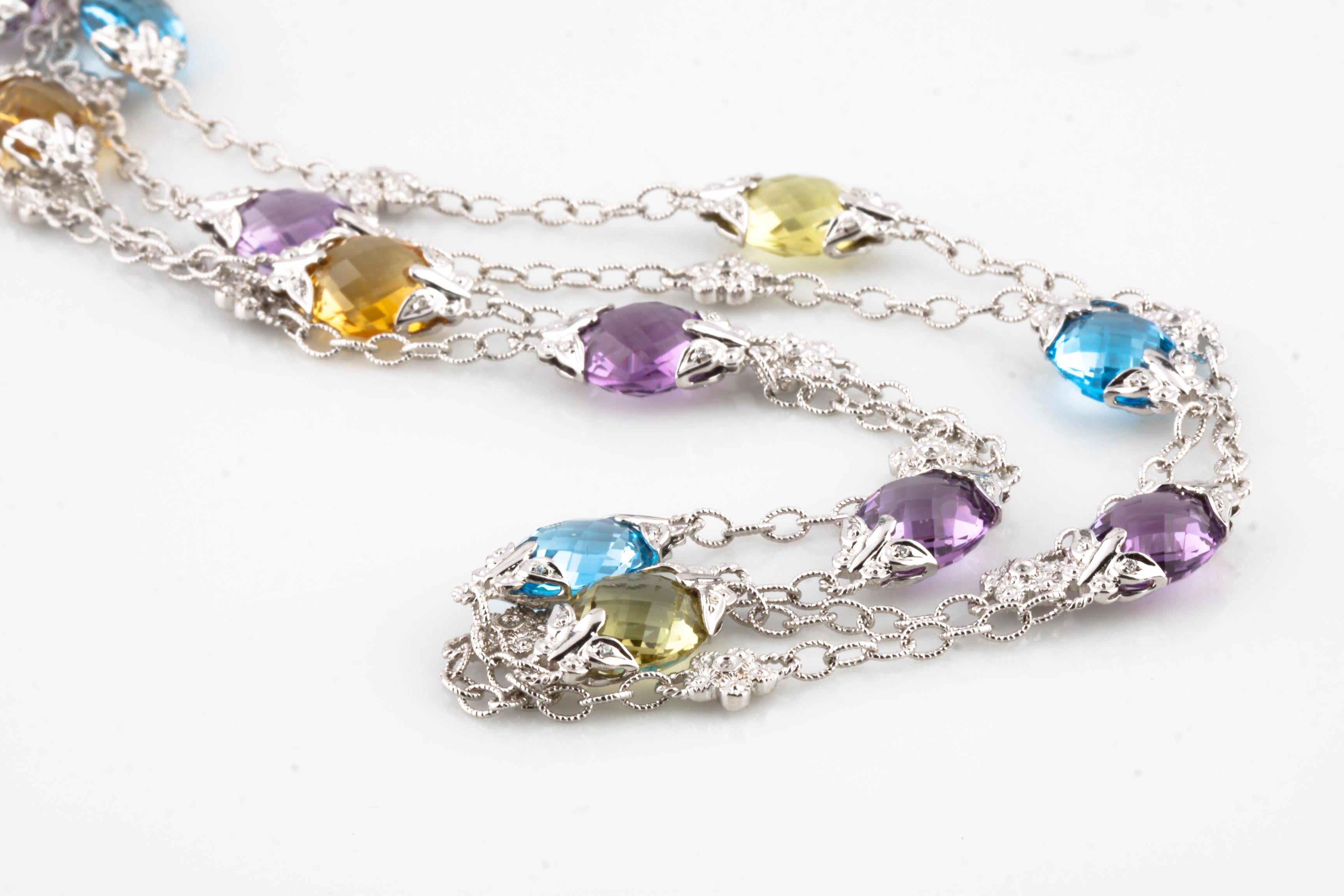 Amazing, Unique 14k White Gold Chain Necklace
Features Amber, Blue, and Lilac-Colored Briolette-Cut Topaz in Alternating Pattern w/ Flower-Shaped Stations Set with a Round-Cut Diamond.
Each Briolette Station is Set with Eight Small Round-Cut