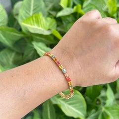 Mehrfarbiges, handgefertigtes Tennisarmband aus 18 Karat Gelbgold mit 12,25 Karat Saphir