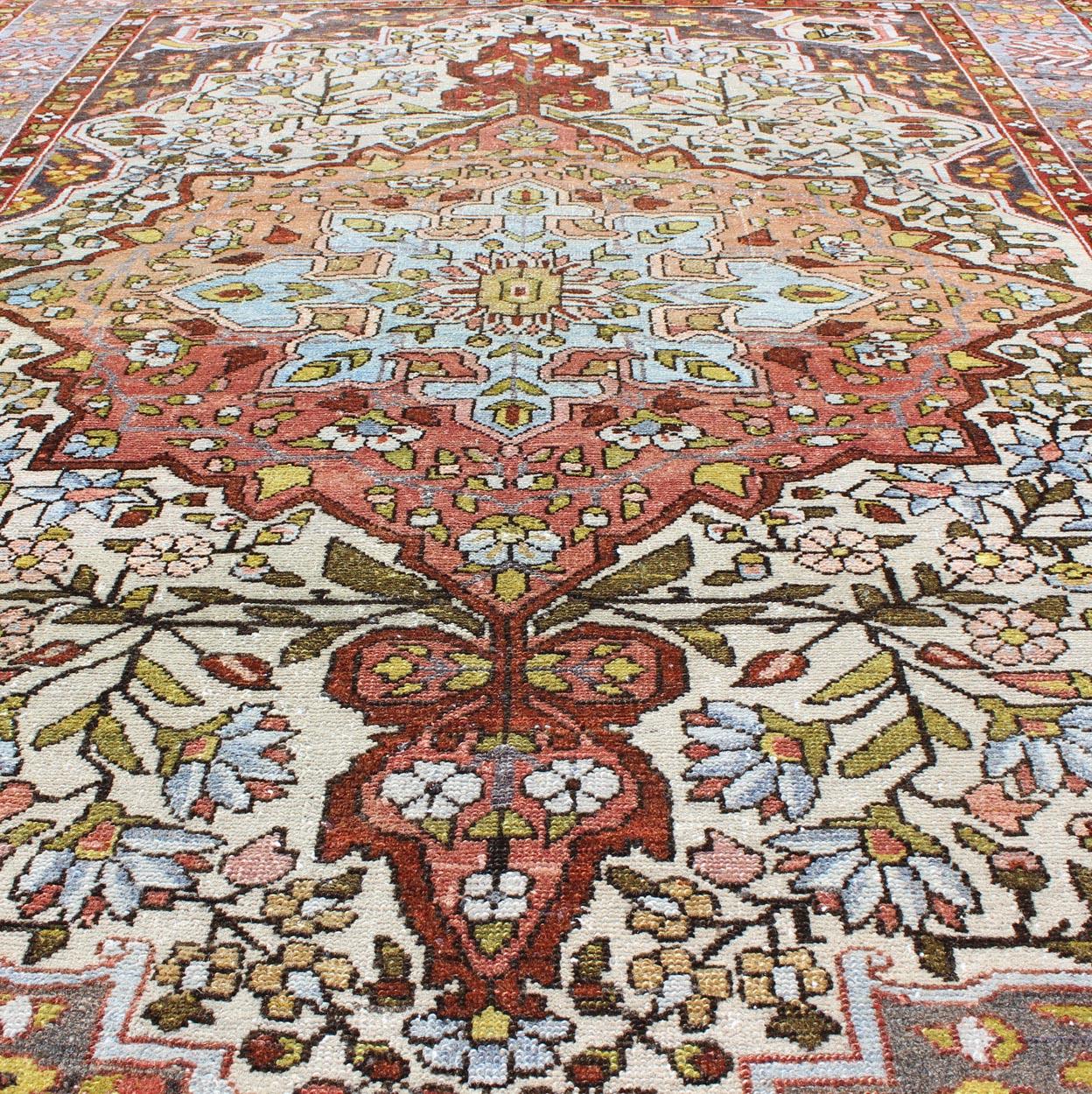 Multi-Colored and Ivory Antique Persian Bakhtiari Rug with Floral Medallion In Good Condition For Sale In Atlanta, GA