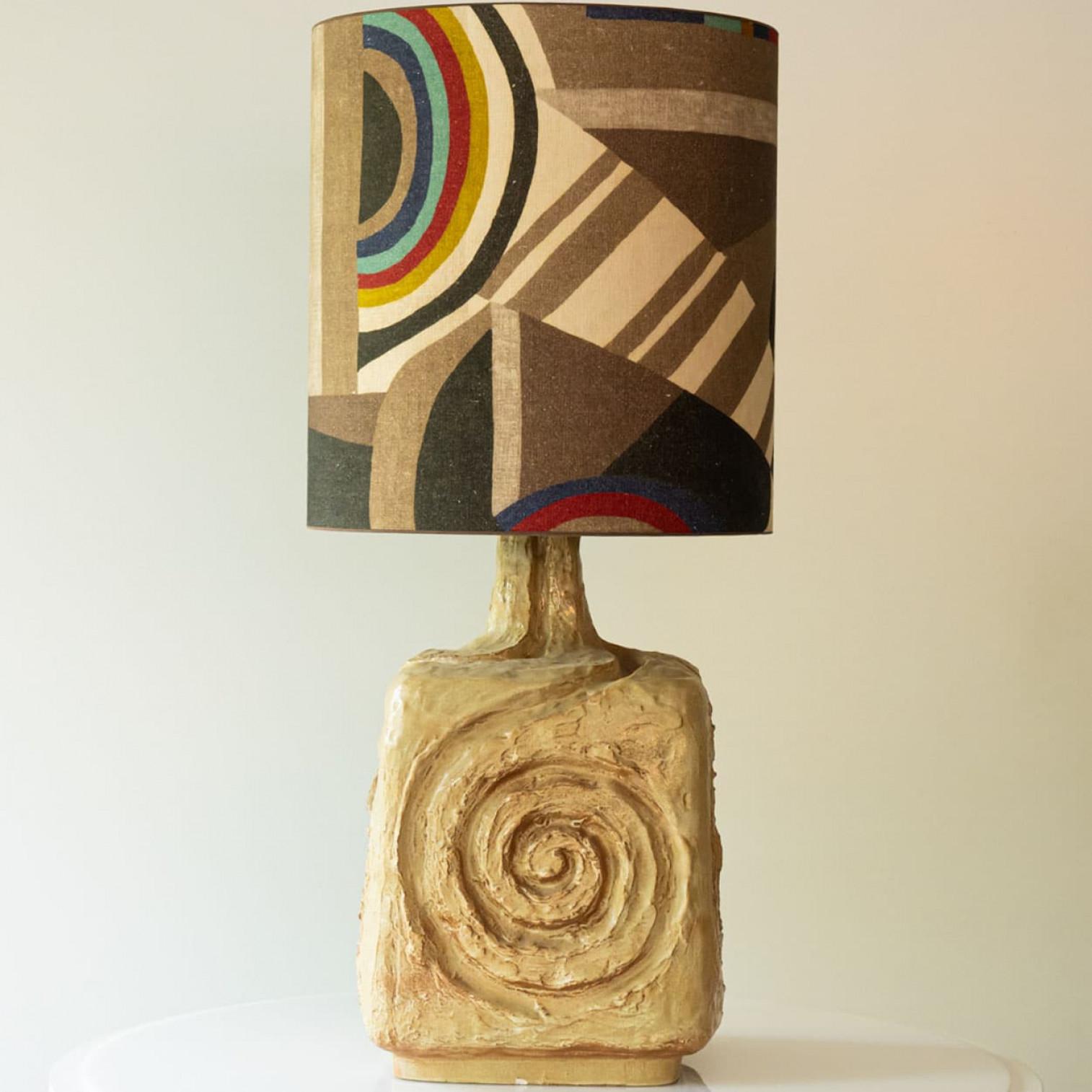 Heavy quality ceramic table lamp,  1970s.

This  lamp base brings refined elegance and rich visual appeal to any interior. With its beautiful shape, it offers a unique presence.

This natural ceramic base with a swirl carved in the middle, fits