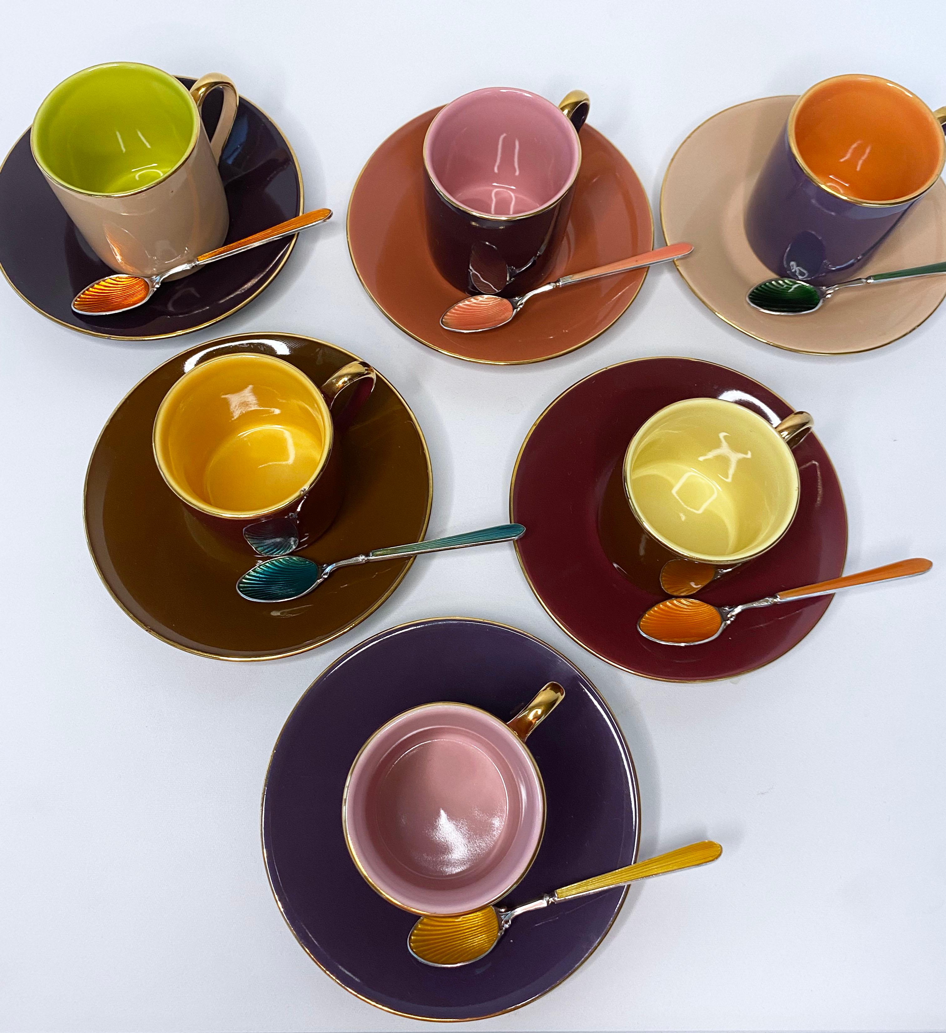 Fun yet Elegant multi colored Coffee Cup & Spoon Set. The Coffee Cups and Plates come in a set of 6 which showcase a beautiful warm complimentary palette that is easily paired among itself. A stunning set of never before used Vintage Enamel Spoons