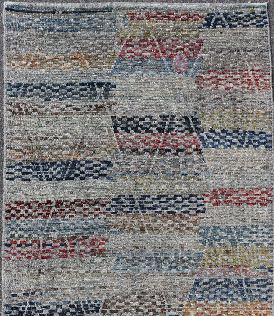 Modern and casual Gallery Runner Neutrals, charcoal, gray, red, blue and brown diamond Afghan Modern Kilim Geometric design. Keivan Woven Arts / Rug AFG-31832, country of origin / type: Afghanistan / piled

The unique design of this groovy tribal