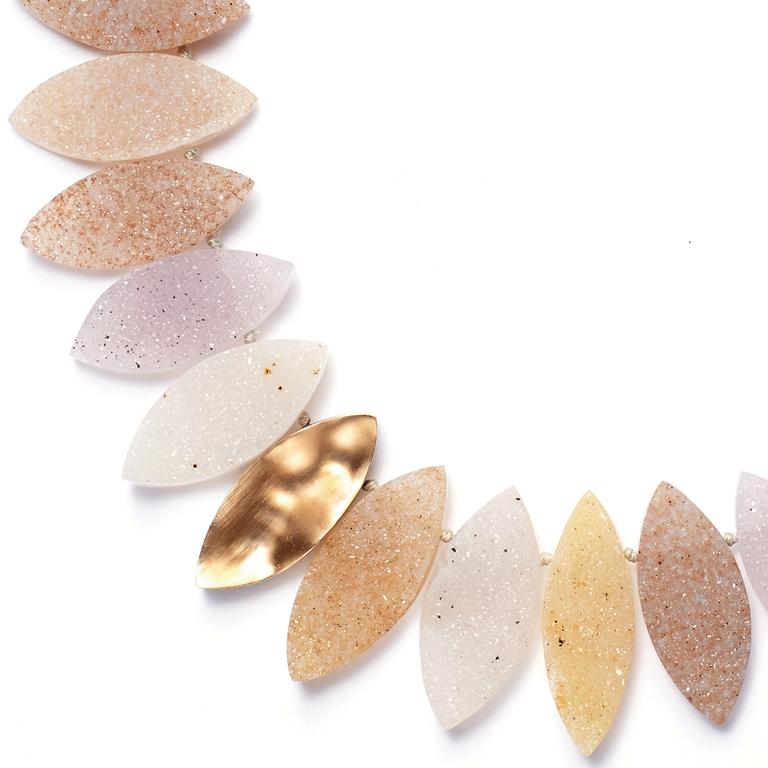This eye-catching, multi-colored necklace of carved Druzy Quartz is set with 18 Karat Rose and Yellow Gold Leaves. Finished with an 18 Karat Gold clasp.

18-inches.
