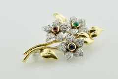 Multicolored Flower Diamond, Emerald, Sapphire and Ruby Brooch in 18 Karat