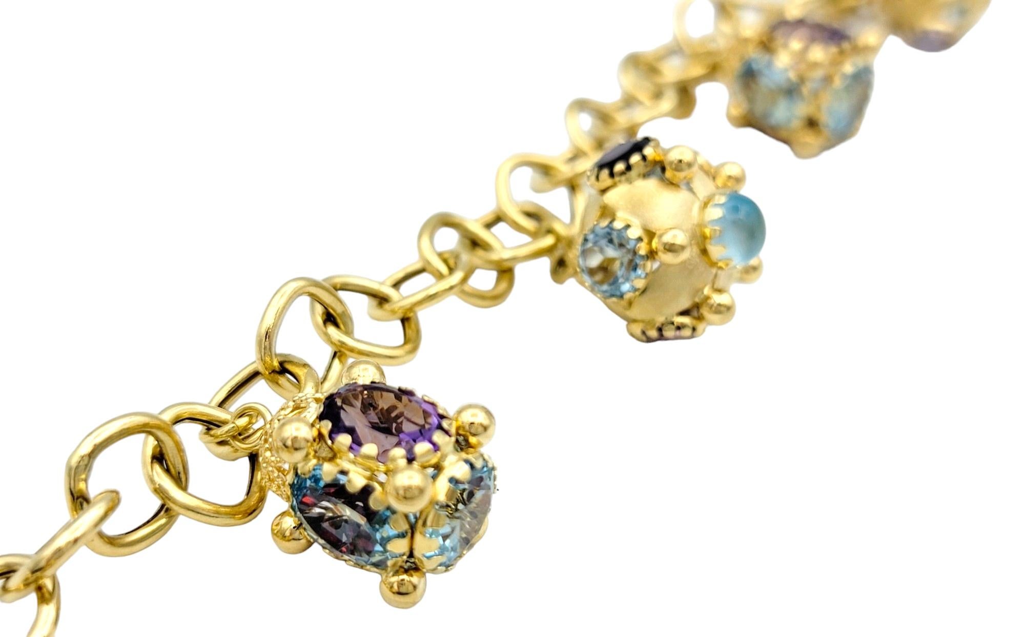 Oval Cut Multi-Colored Gemstone Dangle Charm Bracelet Set in 18 Karat Yellow Gold For Sale